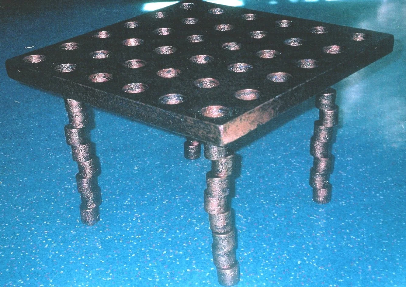 table with legs made of holes