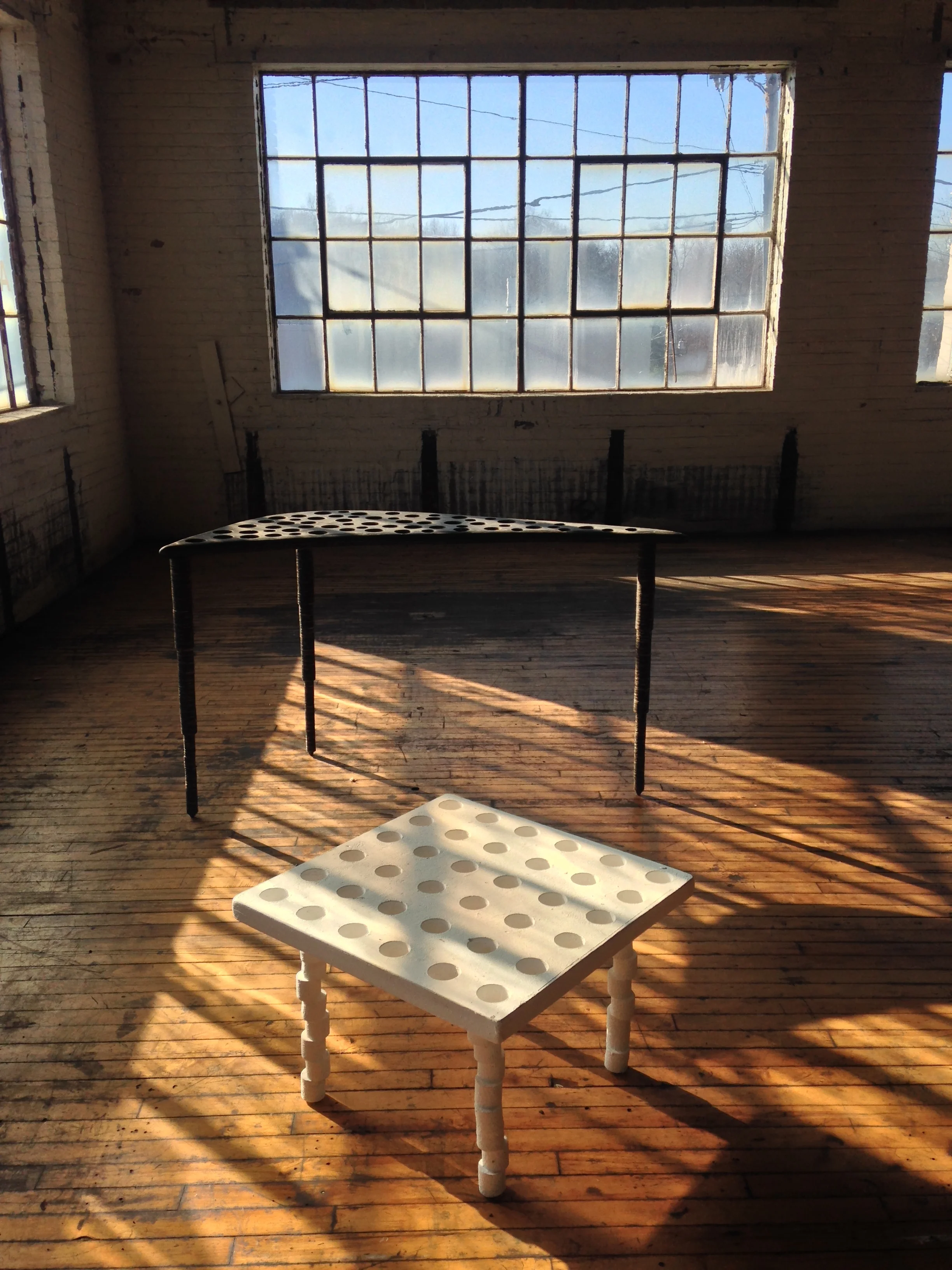  tables with legs made of holes 