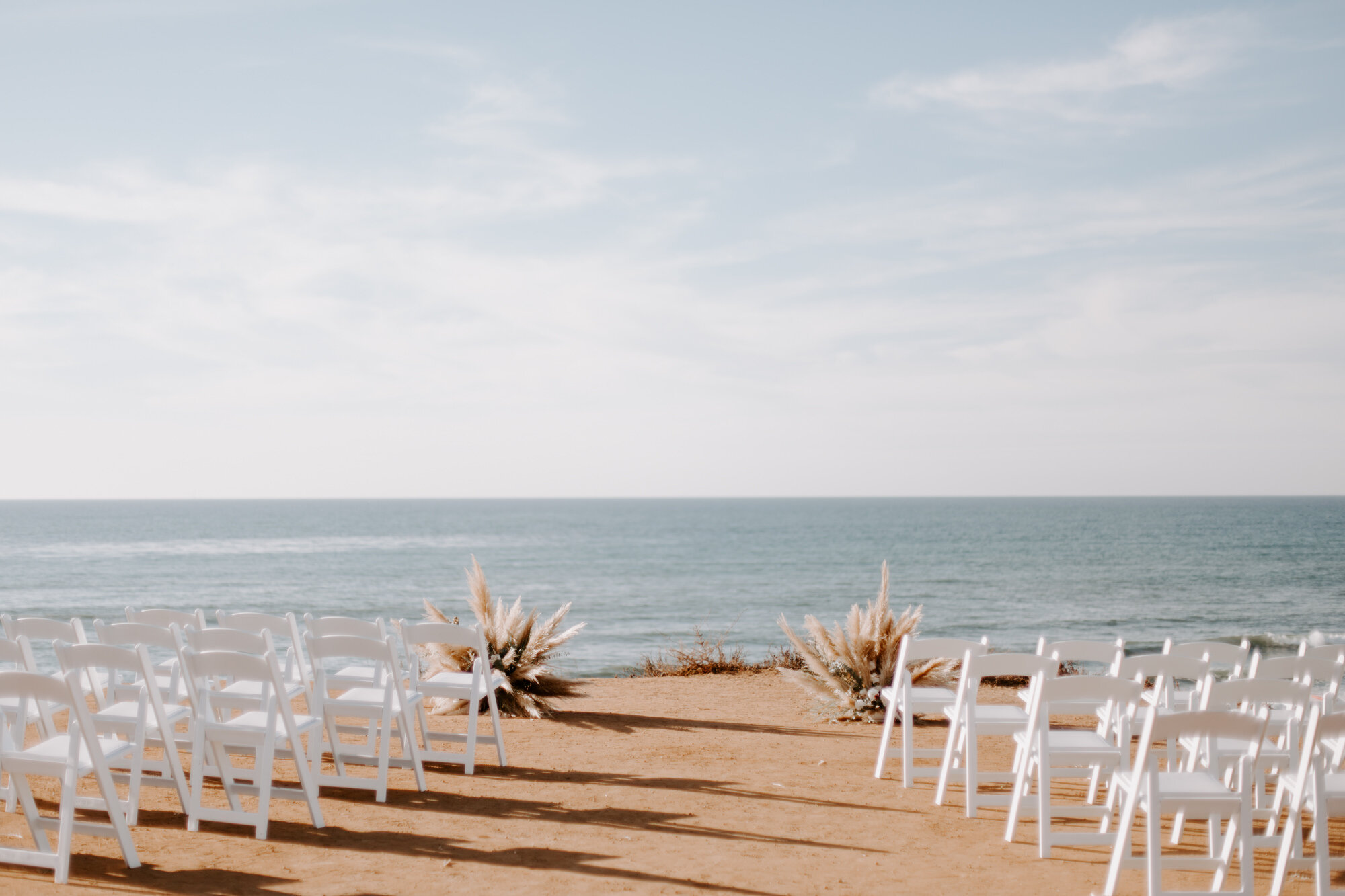 Sunset cliffs wedding, elopement in point loma san diego. Wedding and elopement with pampas grass and pink tones in the bouquets. This was a bohemian or boho styled wedding near the beach.