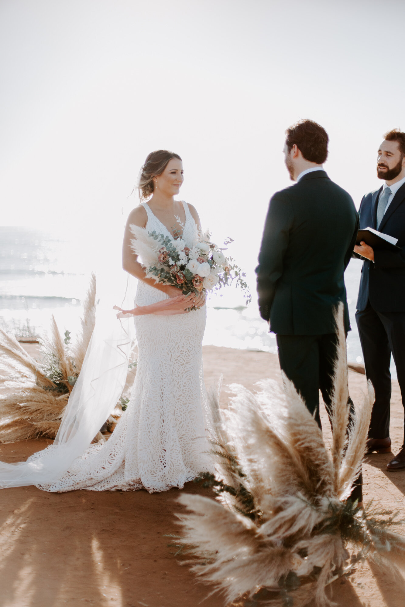 Sunset cliffs wedding, elopement in point loma san diego. Wedding and elopement with pampas grass and pink tones in the bouquets. This was a bohemian or boho styled wedding near the beach.