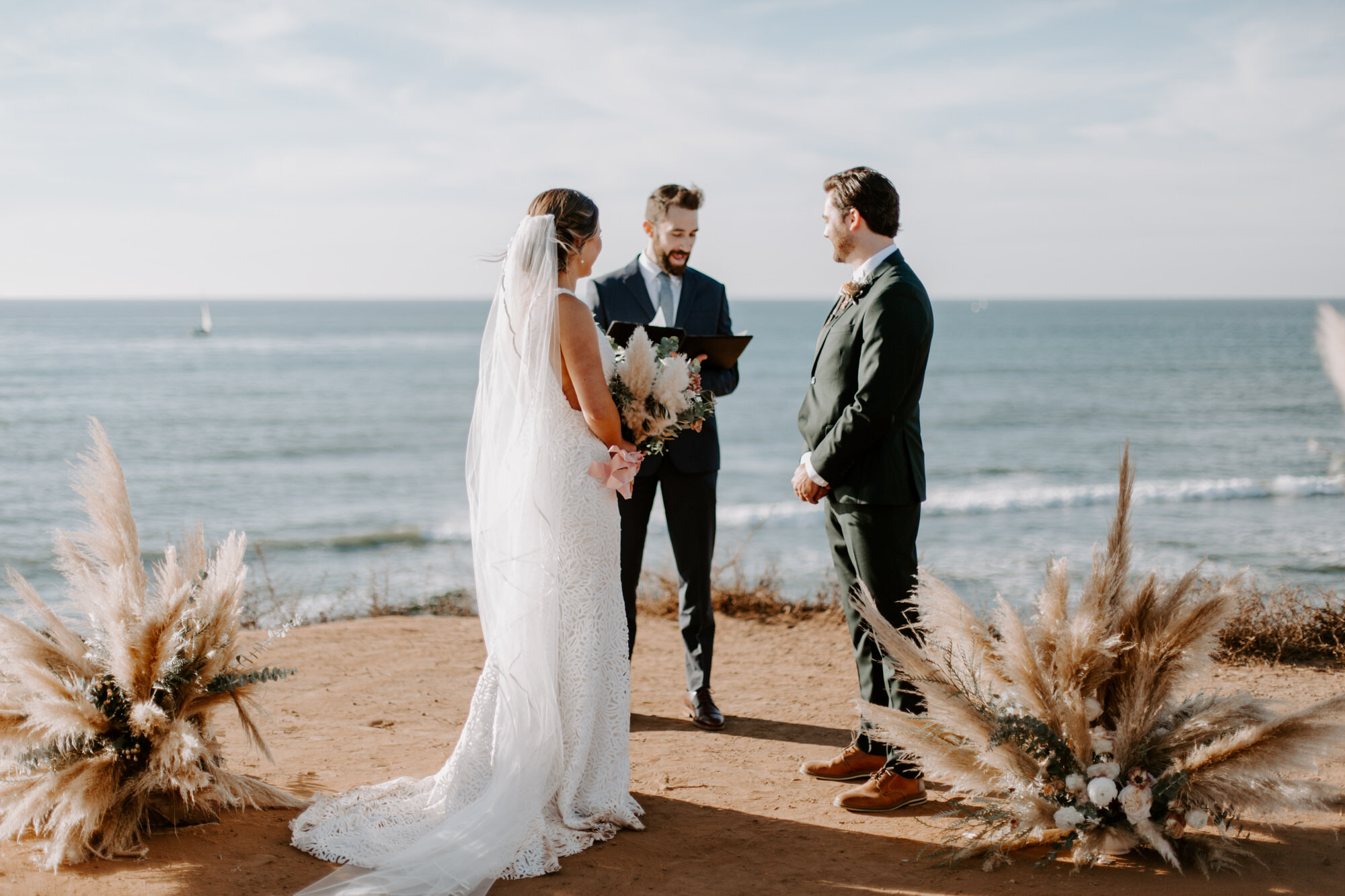 Sunset cliffs wedding, elopement in point loma san diego. Wedding and elopement with pampas grass and pink tones in the bouquets. This was a bohemian or boho styled wedding near the beach.