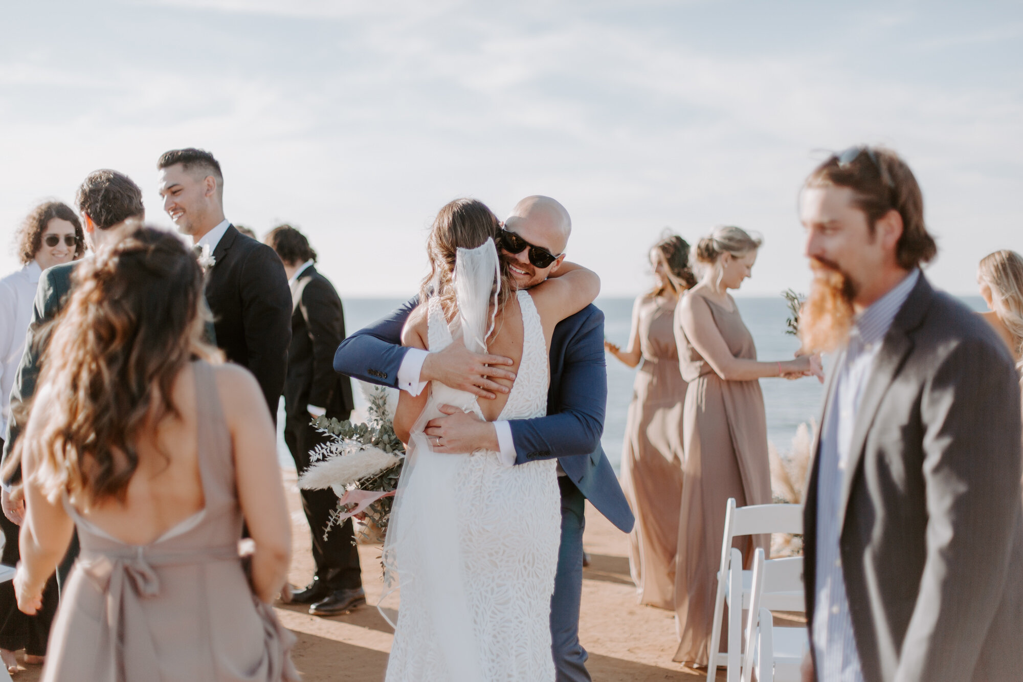 Sunset cliffs wedding, elopement in point loma san diego. Wedding and elopement with pampas grass and pink tones in the bouquets. This was a bohemian or boho styled wedding near the beach.