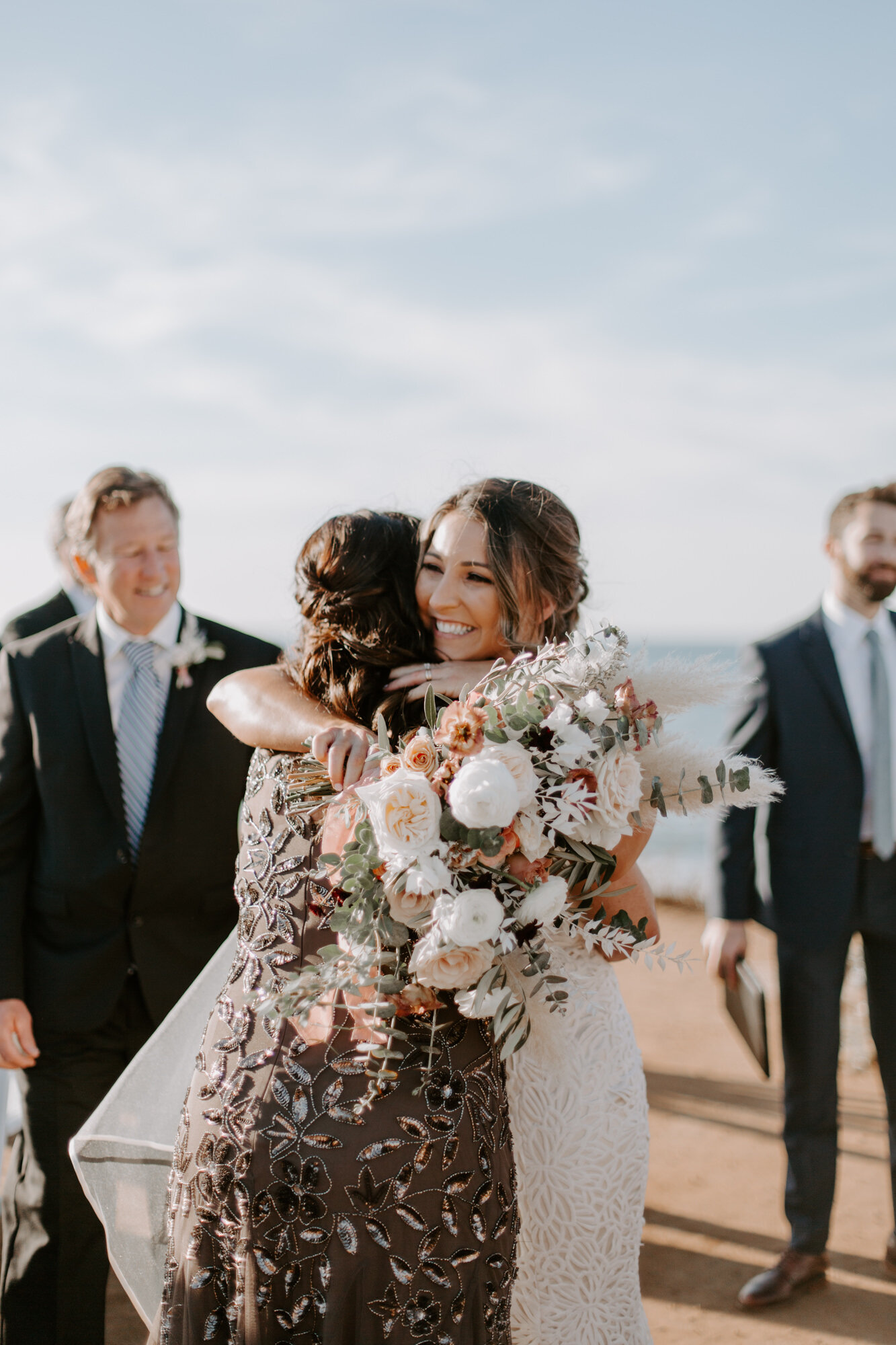 Sunset cliffs wedding, elopement in point loma san diego. Wedding and elopement with pampas grass and pink tones in the bouquets. This was a bohemian or boho styled wedding near the beach.