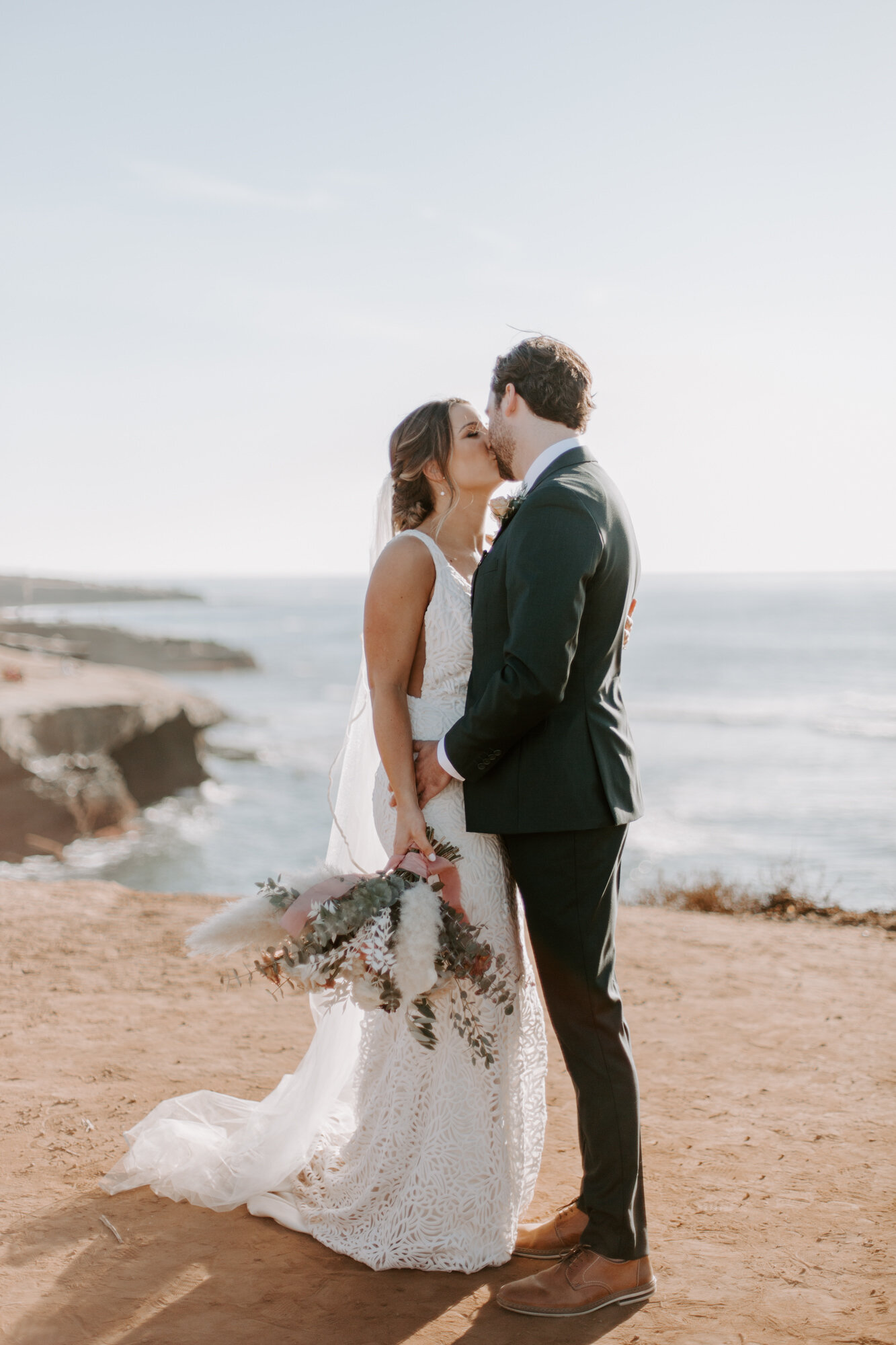 Sunset cliffs wedding, elopement in point loma san diego. Wedding and elopement with pampas grass and pink tones in the bouquets. This was a bohemian or boho styled wedding near the beach.