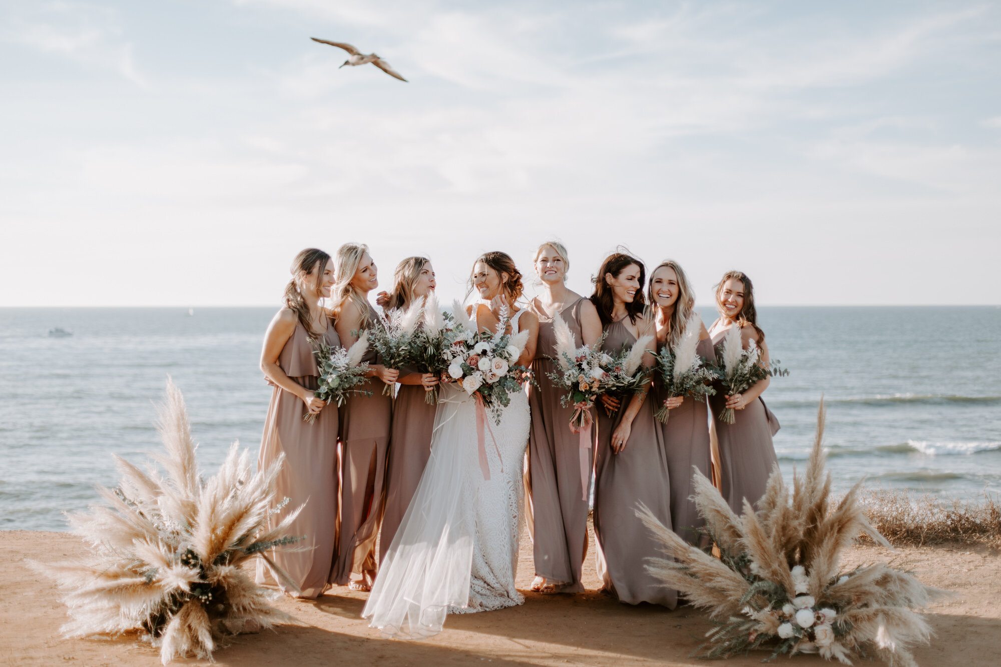 Sunset cliffs wedding, elopement in point loma san diego. Wedding and elopement with pampas grass and pink tones in the bouquets. This was a bohemian or boho styled wedding near the beach.