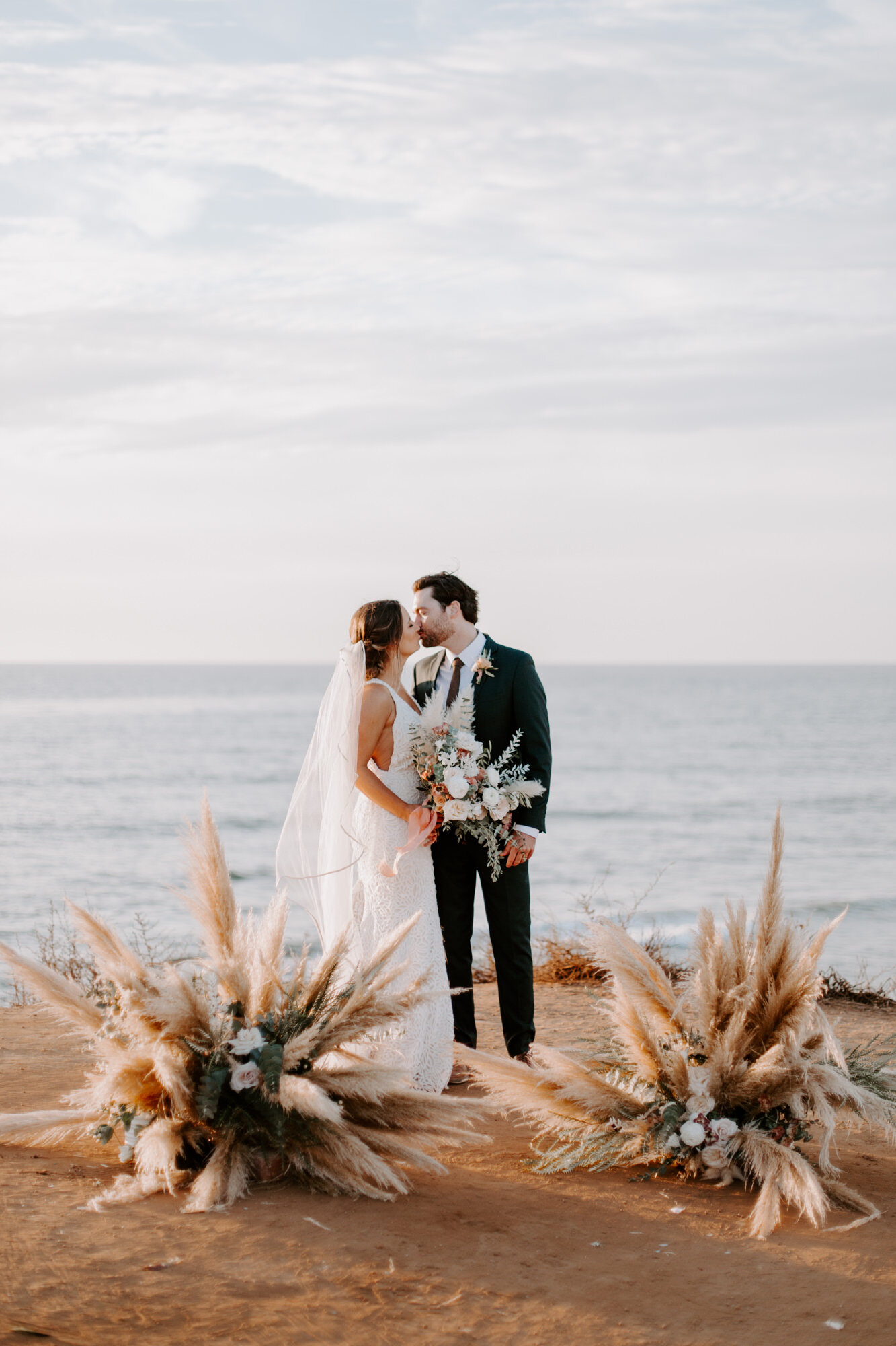 Sunset cliffs wedding, elopement in point loma san diego. Wedding and elopement with pampas grass and pink tones in the bouquets. This was a bohemian or boho styled wedding near the beach.