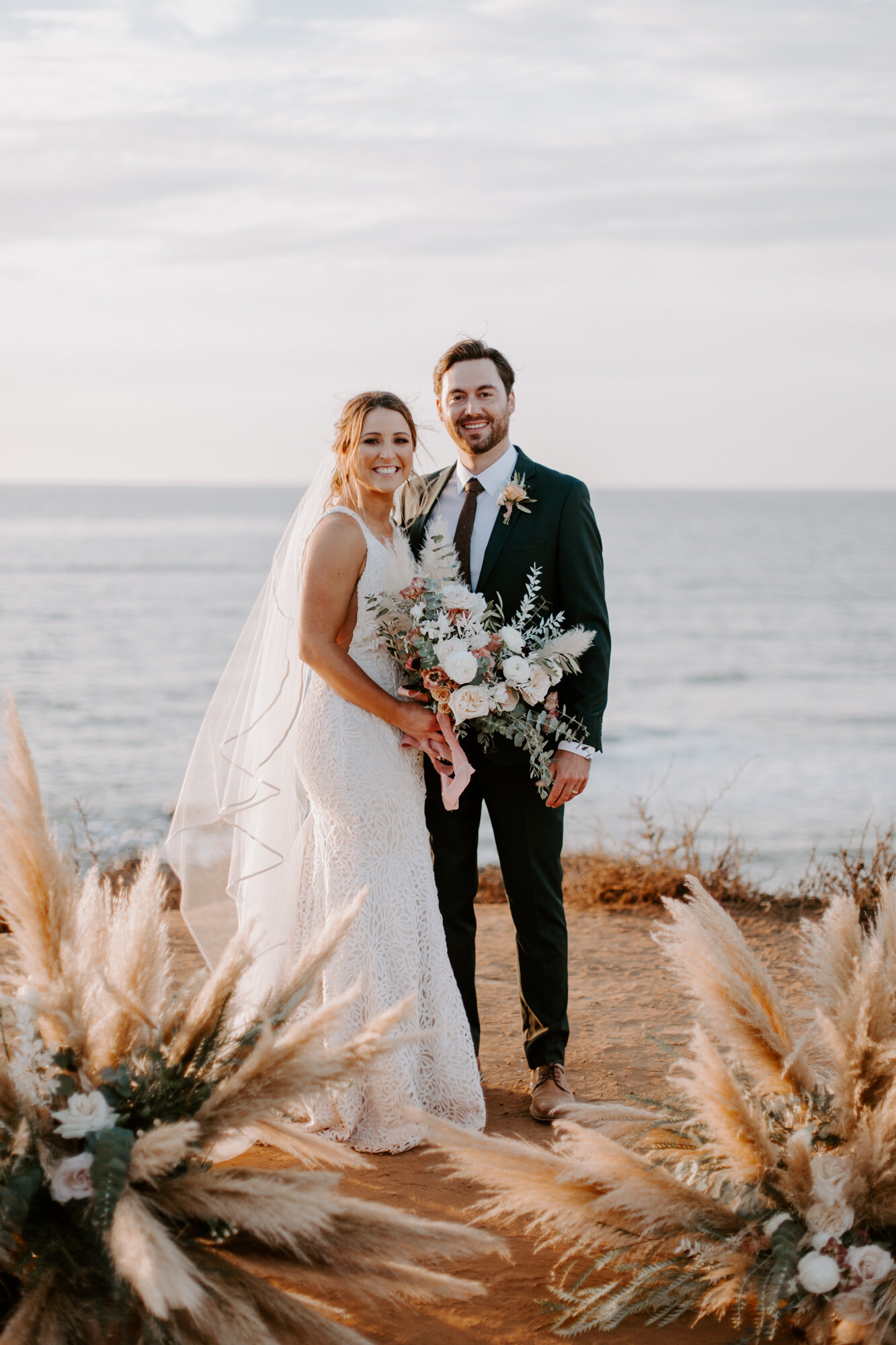 Sunset cliffs wedding, elopement in point loma san diego. Wedding and elopement with pampas grass and pink tones in the bouquets. This was a bohemian or boho styled wedding near the beach.