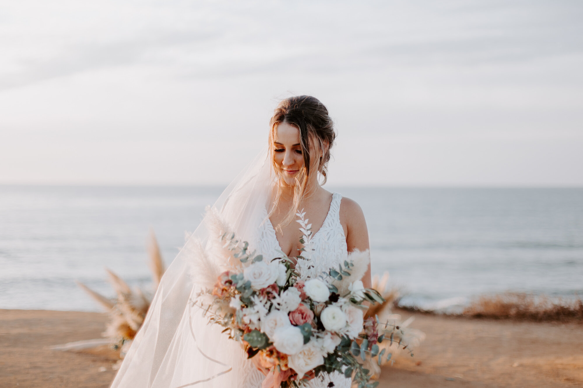 Sunset cliffs wedding, elopement in point loma san diego. Wedding and elopement with pampas grass and pink tones in the bouquets. This was a bohemian or boho styled wedding near the beach.