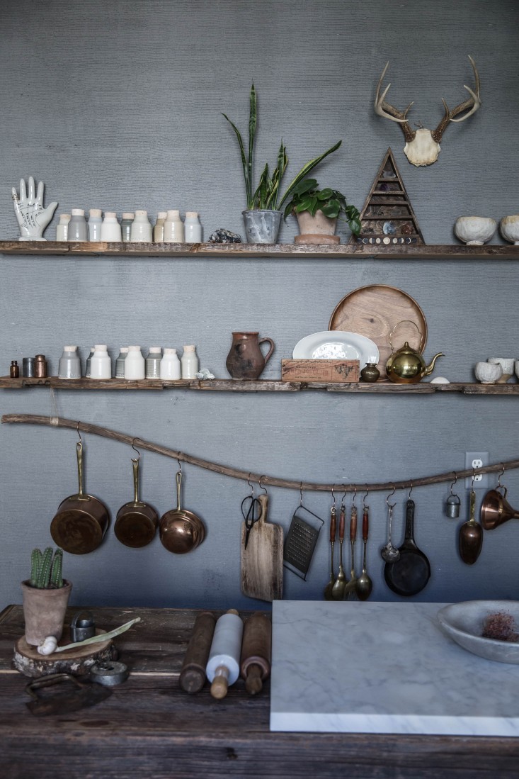 Both beautiful and practical; a branch of driftwood acts as a utensil rail for Beth’s most-used tools.