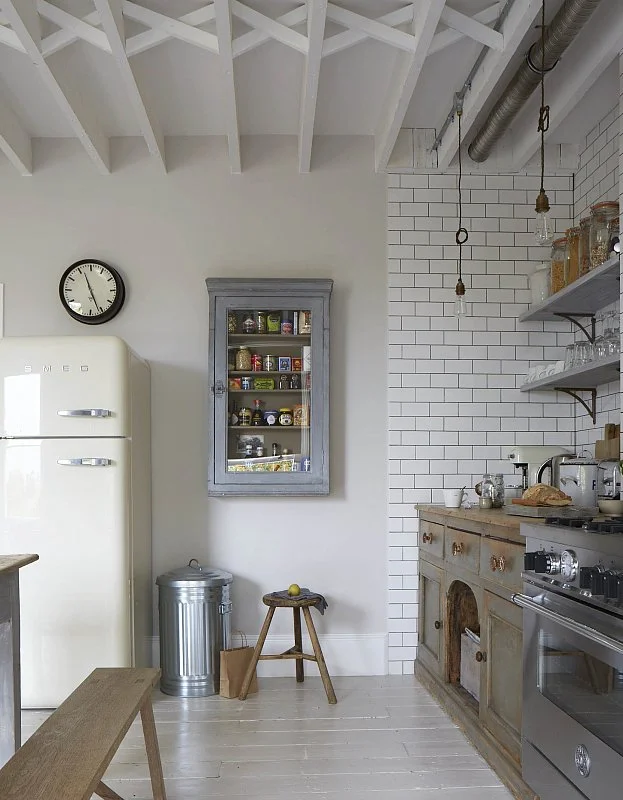 I love the glass-fronted wall cabinet. Perfect for keeping all of your essentials at easy reach.