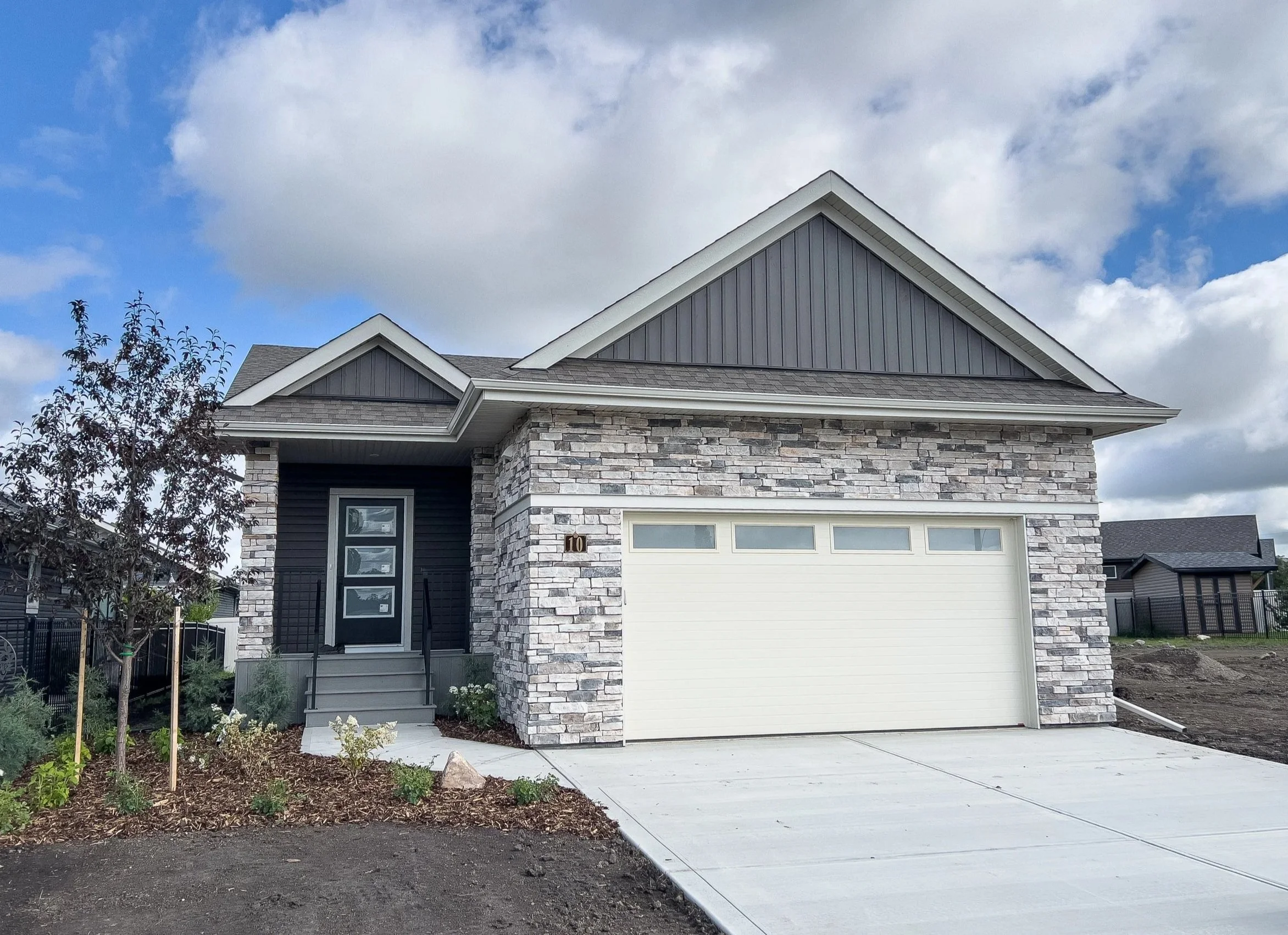 10 Tindale Place Ready in August The Timbers Maintenance Free Living Fully finished bungalow 3 Bedrooms / 2.5 Bathrooms $709,900 DETAILS