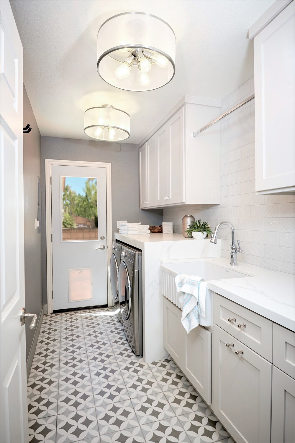 A Del Mar Laundry Room that has storage for pet food and more!