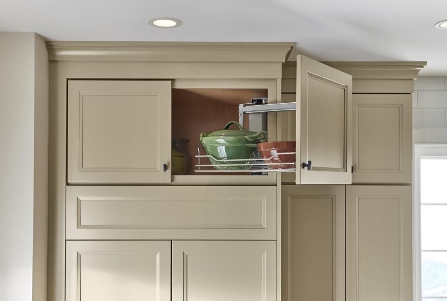 Above Appliance Swing Out Organizer   One of the more in-depth products on our list, is an organizer that works perfectly over the oven or fridge. It can be side mounted to either the left or right side of the cabinet wall.