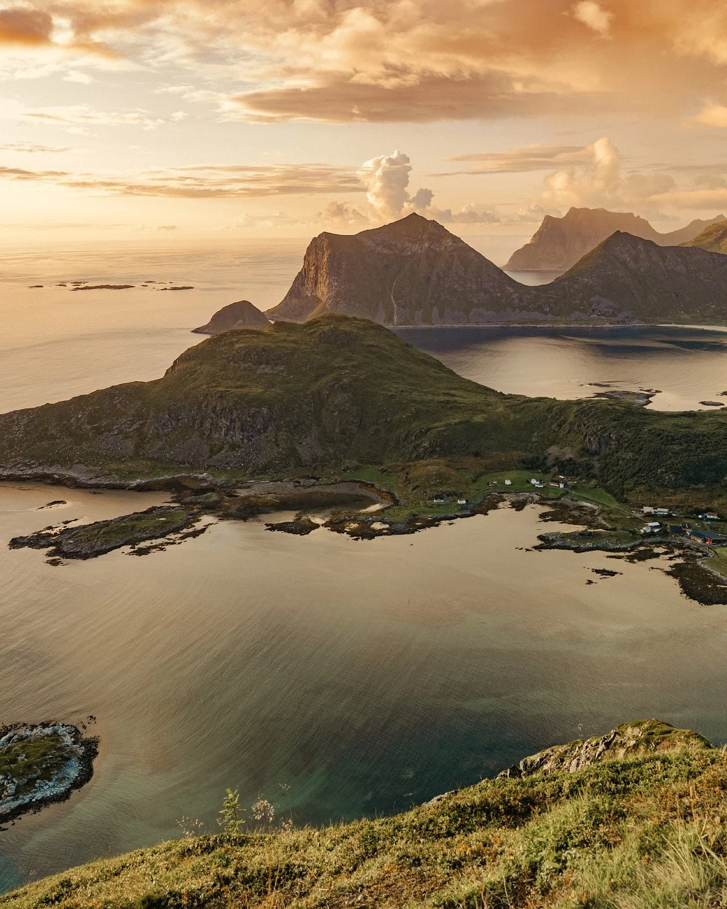 How does one even begin to explain rugged, natural beauty like this? Where arctic mountains jet out of a frigid, yet colorful sea. And grasses sway and seagulls chirp as the fog rolls in. And the road hugs the ridges, dotted with little red roofs, so