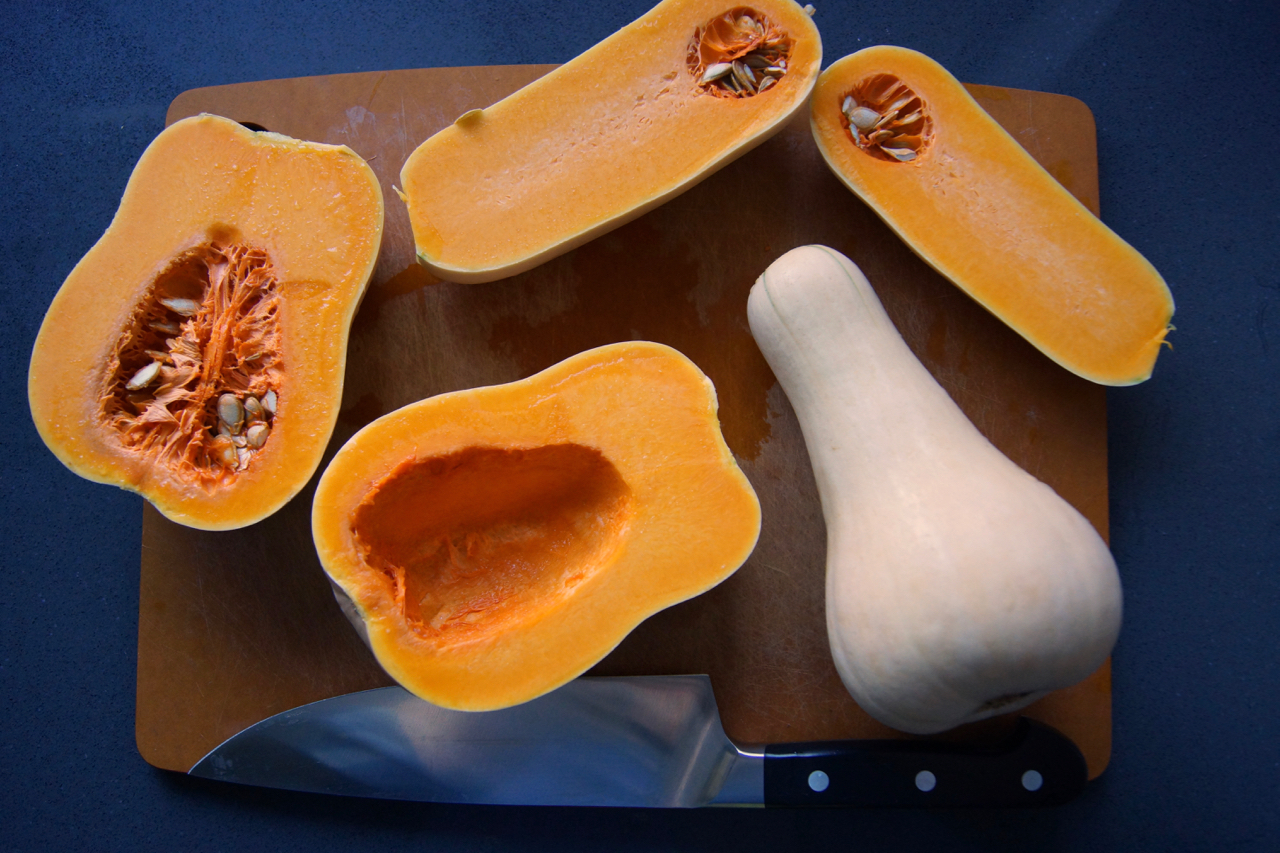 Cut the squash, and scoop out the seeds.