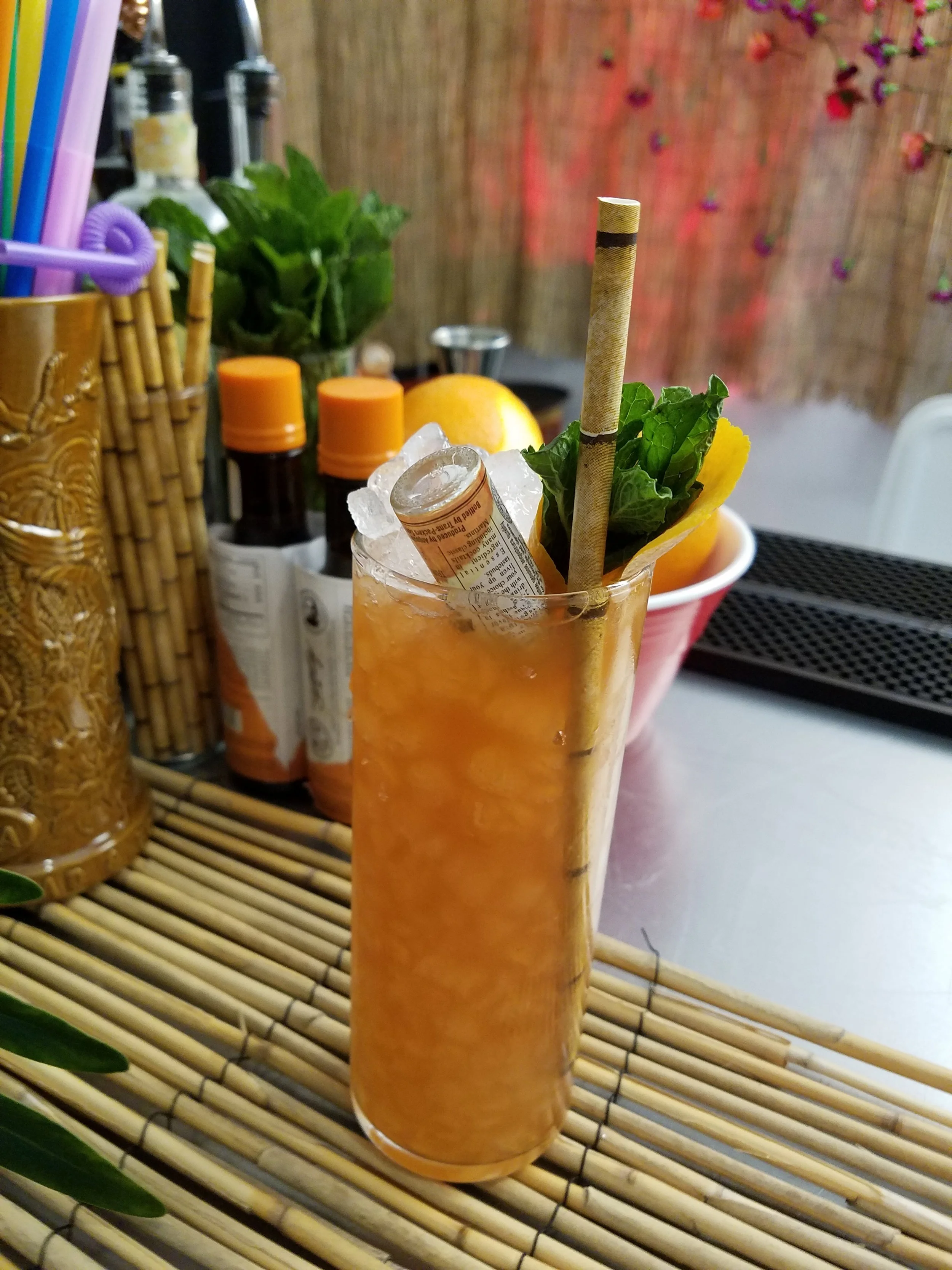 Another beauty from State Lines. The Smugtown Swizzle, made with Angostura white oak rum, Amaro di Angostura, spiced coffee demerara, lime, and a whole mini-bottle of orange bitters.