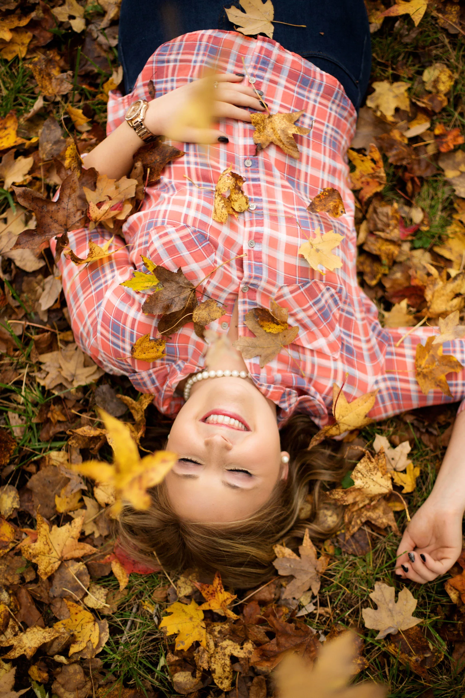 laying-in-fall-leaves-senior-girl-pics.jpg