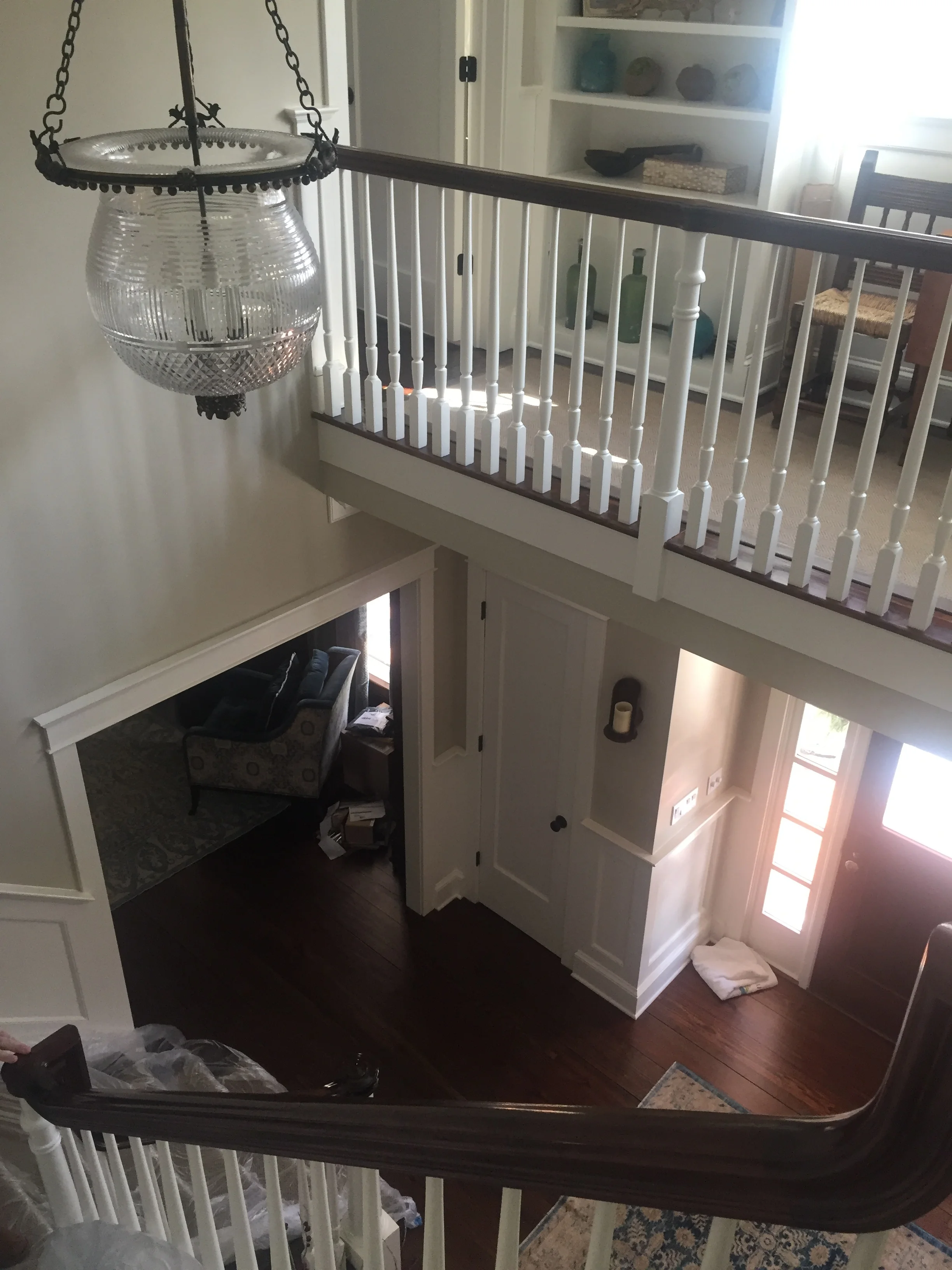  this home had a huge empty 2 story foyer. Peter broke it up with the creation of a 2nd level balcony &amp; custom designed stairwell. a new entrance was created to the upstairs master bedroom. 