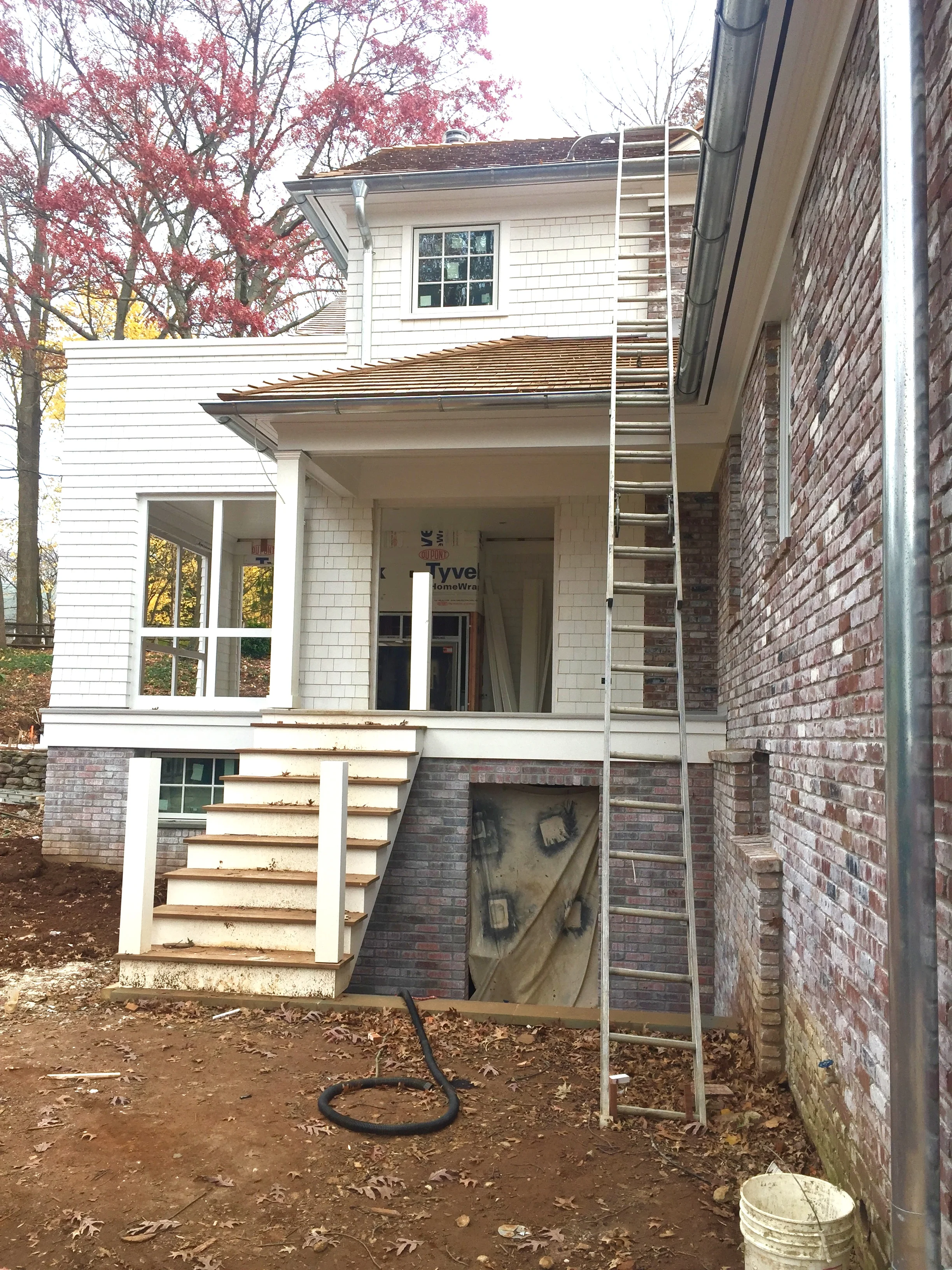 lower level entry into the playroom, guest bedroom suite & home gym