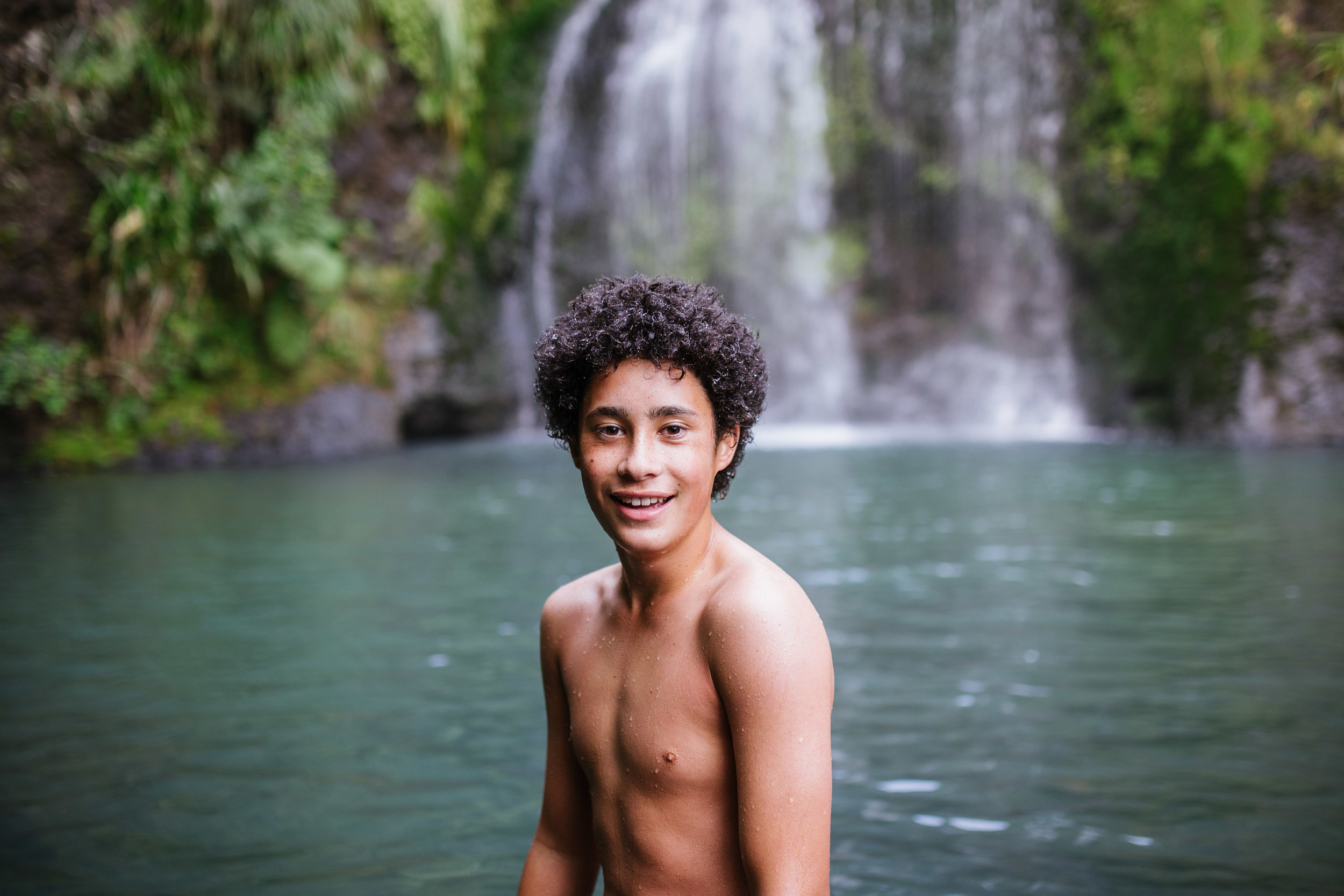  May 6 2017.   My cousin Vincent (Vinny) climbing out of the secluded pool of Kitekite Falls near Piha Beach, New Zealand. With us were various members of our family and Vinny's dog, Blue. To get to this part of the falls, we hiked freely through bru