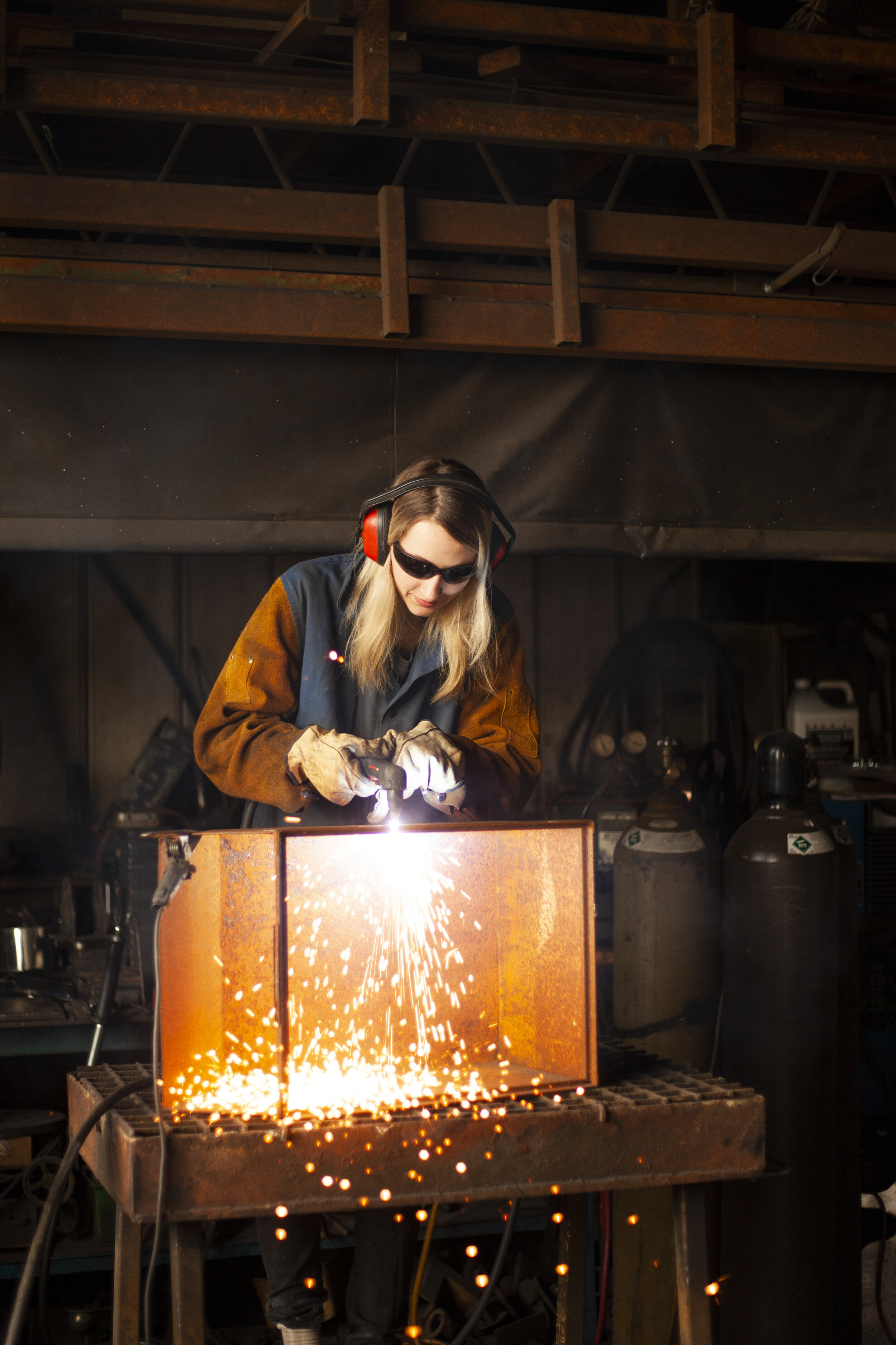 Shot while on assignment for Metroland Media: Port Perry Star. May 4 2019.   Metal artist Jasmine Rutschman performing a demonstration with her main tool, a plasma cutter, as part of the Lake Scugog Studio Tours.  