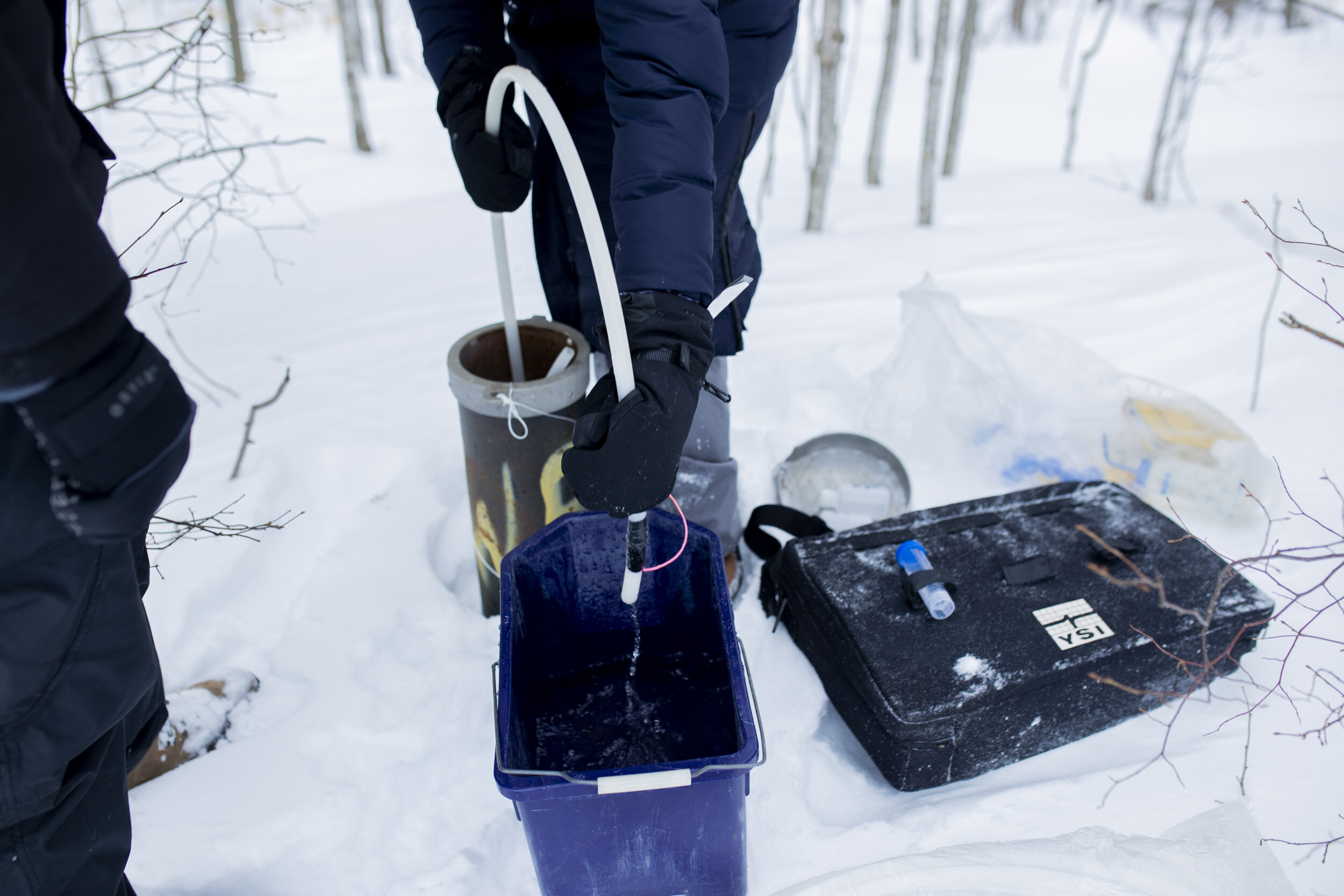  Mitch uses a hand pump to extract groundwater so Wright can collect samples to bring back to the lab. 