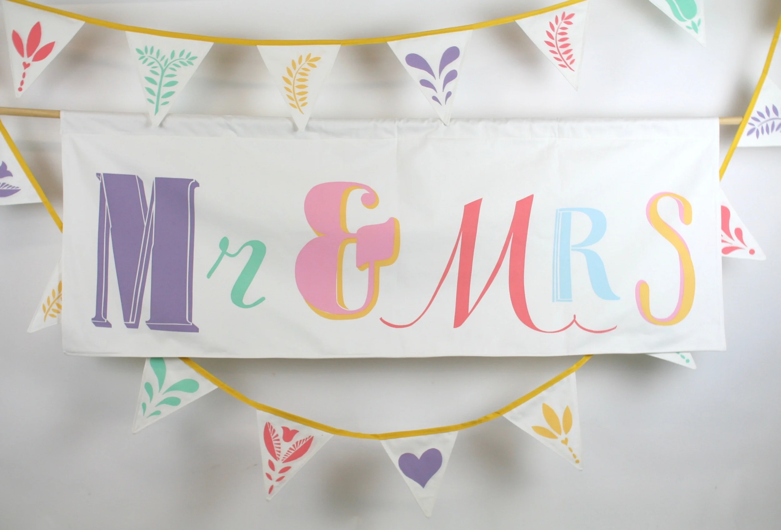Hand screen printed banner measures 150 cm x 55 cm The banner is backed with the same soft brushed cotton as the front and has an integral channel for the hanging pole. HIRE: £50 BUY: £150 BESPOKE: Prices from £250
