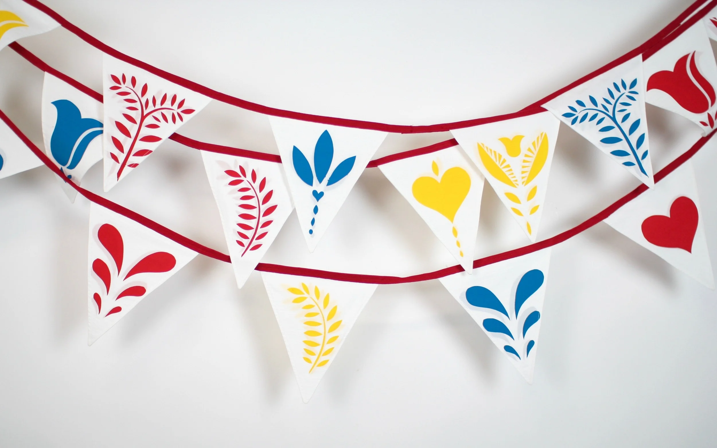 7.9 metres hand sewn and hand screen printed triangular bunting: Flags measure 18.5 cm wide x 21 cm high Flags are printed on both sides for ease of hanging. HIRE: £3.50 per metre BUY: £12 per metre