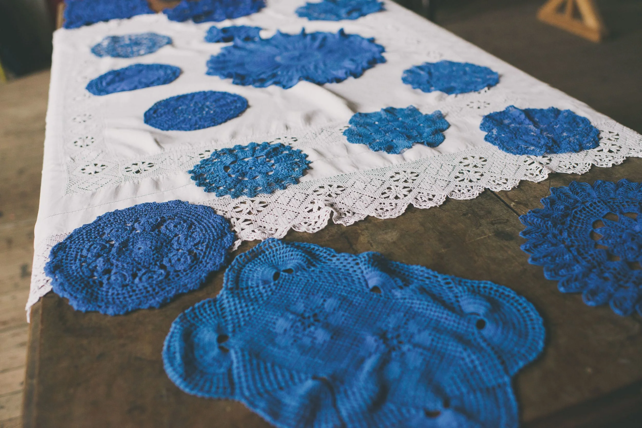 Vintage lace doilies in rich royal blue - various sizes and shapes TO HIRE: £2 each Vintage white linen and lace tablecloth TO HIRE: £5
