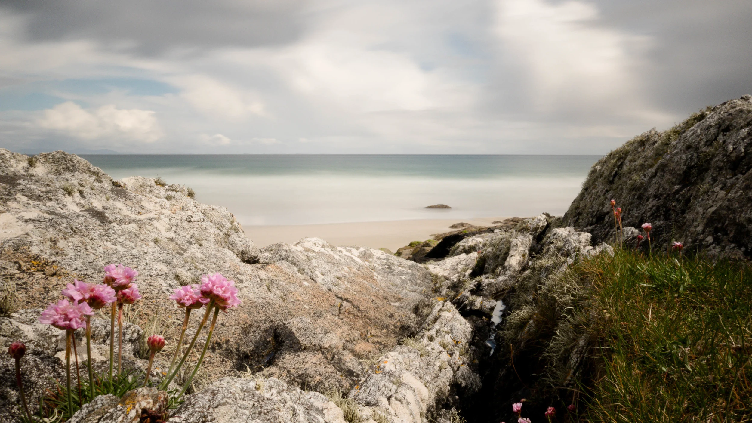Tiree beach, sheltered from the wind down in the rocks.