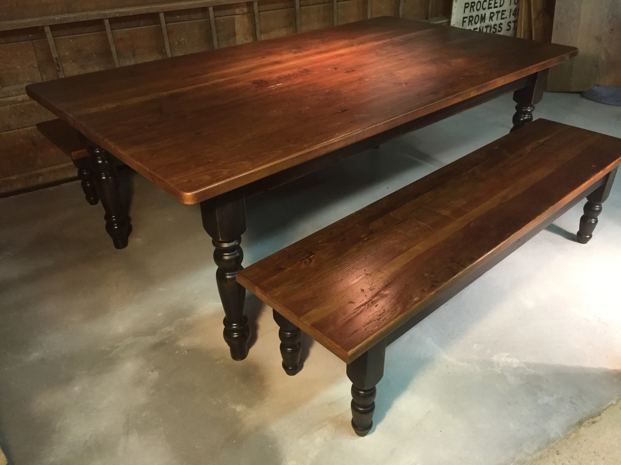 7' thick top table American turned legs, Hazelnut top, Black distressed base and a matching bench