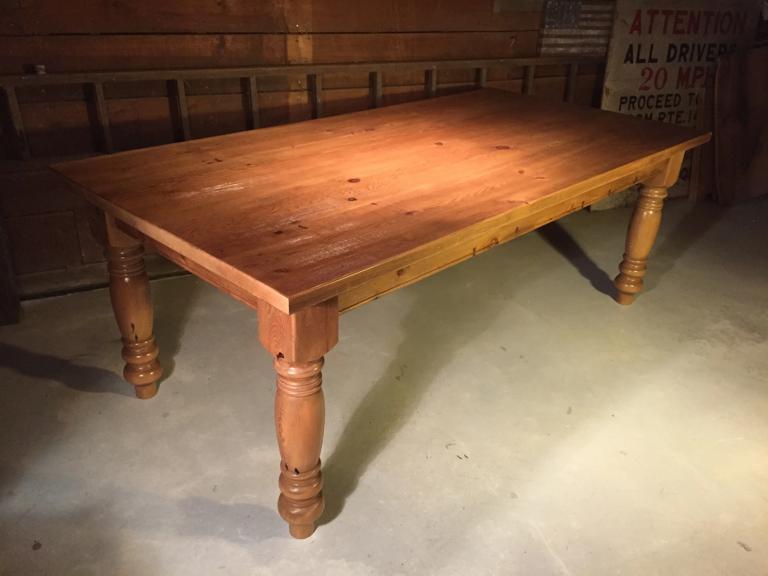 7' thick top English Pine Table with custom oversized turned legs in a Stripped Pine wax