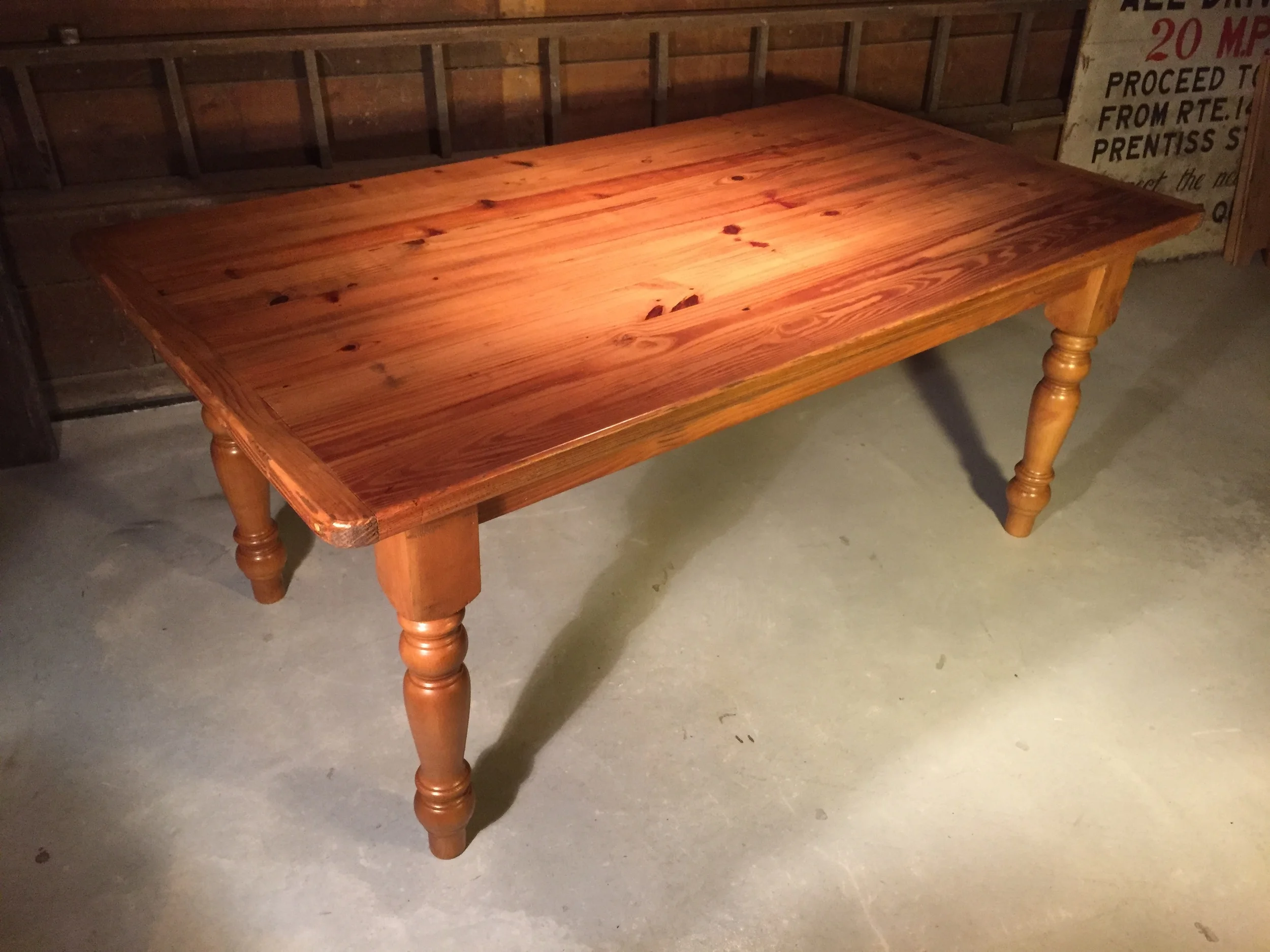 6' thick top dining table with breadboards, large American turned legs and a Cinnamon finish