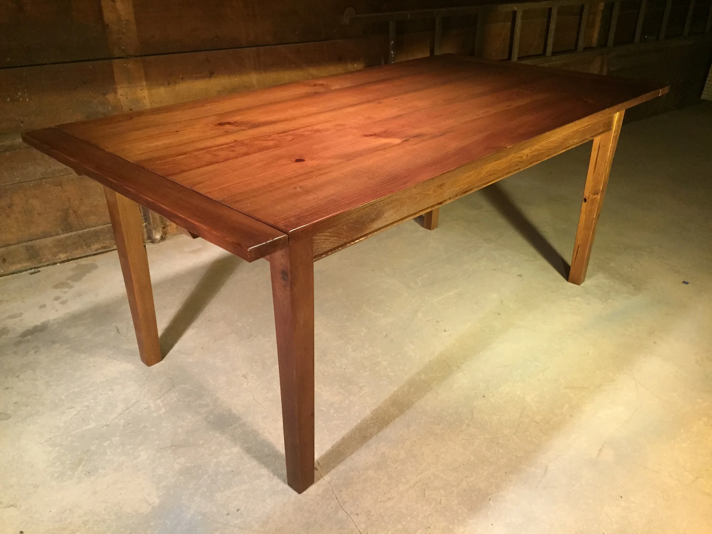 6' English Pine dining table with Custom 4" breadboards, and tapered legs finished in Hazelnut