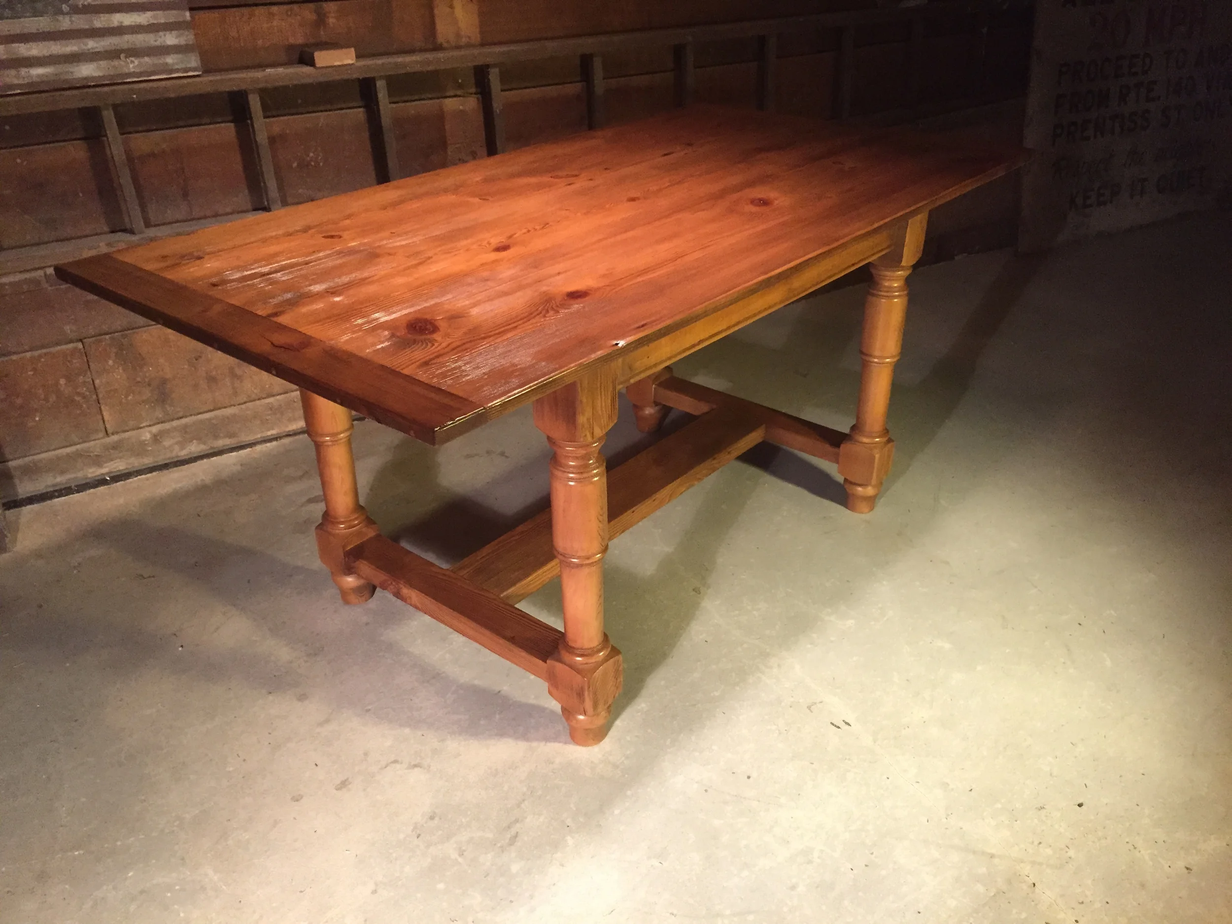 7' thin top English Pine Refectory table with 3" breadboards, turned legs and a weathered texture finished in Rugger Brown wax