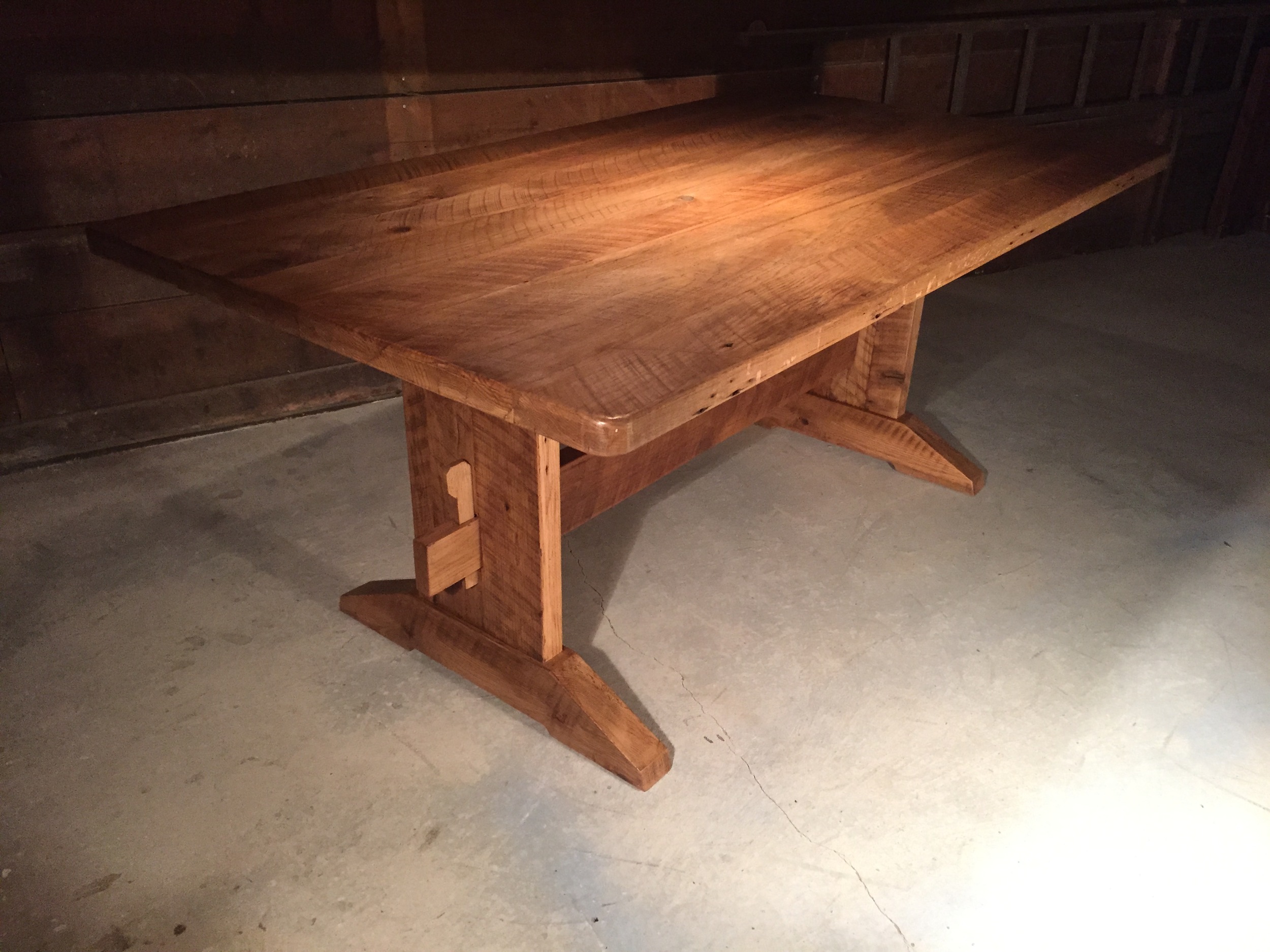 7' thick top reclaimed oak custom trestle finished in Stripped Pine wax