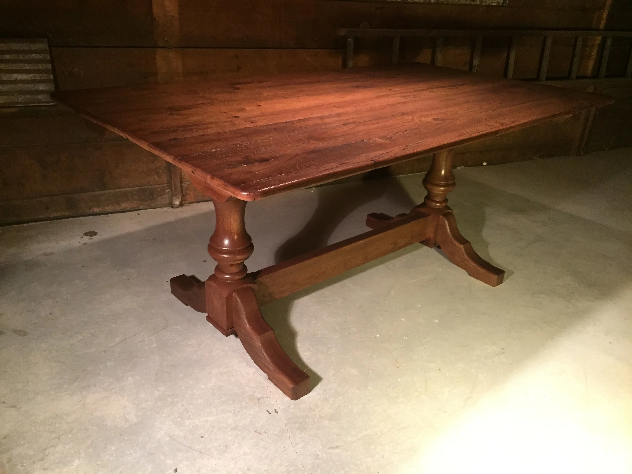 72"x38" thin top Barnwood dining table with double Elegant pedestal finished in Hazelnut 
