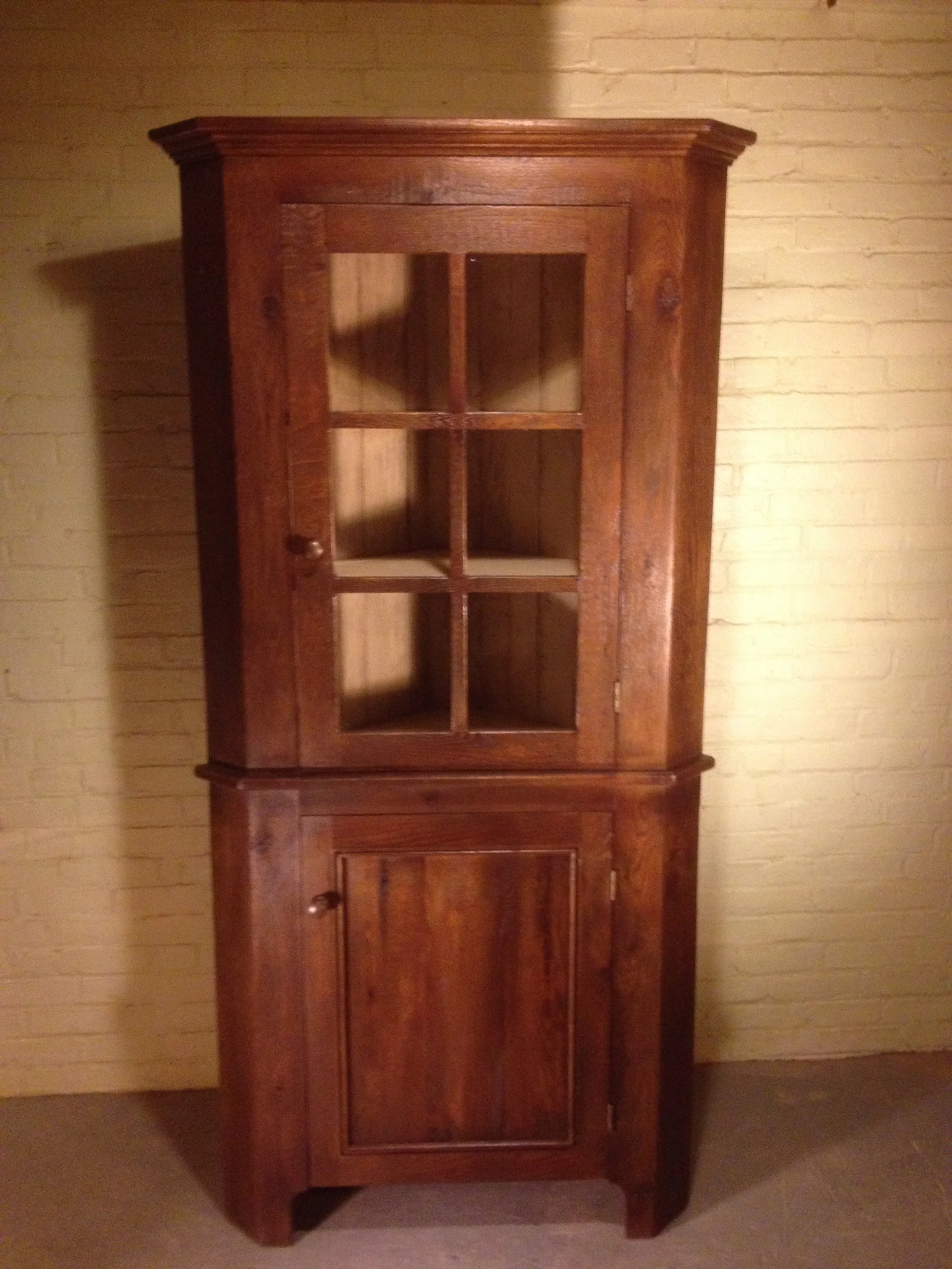40"x19"x76"h Standard Glass door corner cabinet in reclaimed oak finished in Walnut with an Ivory interior