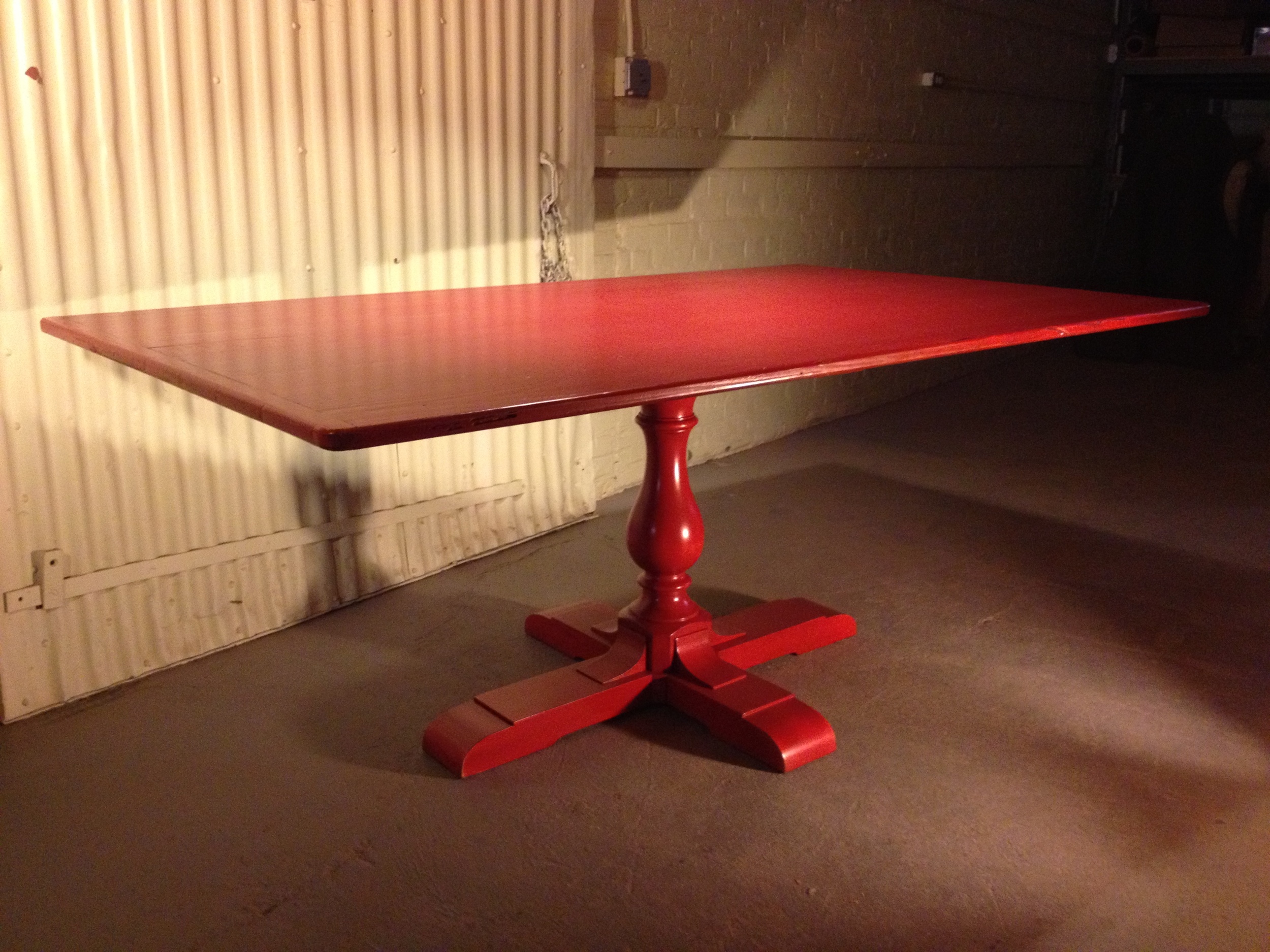 6' thin top table with breadboards and Classic pedestal finished in Tomato