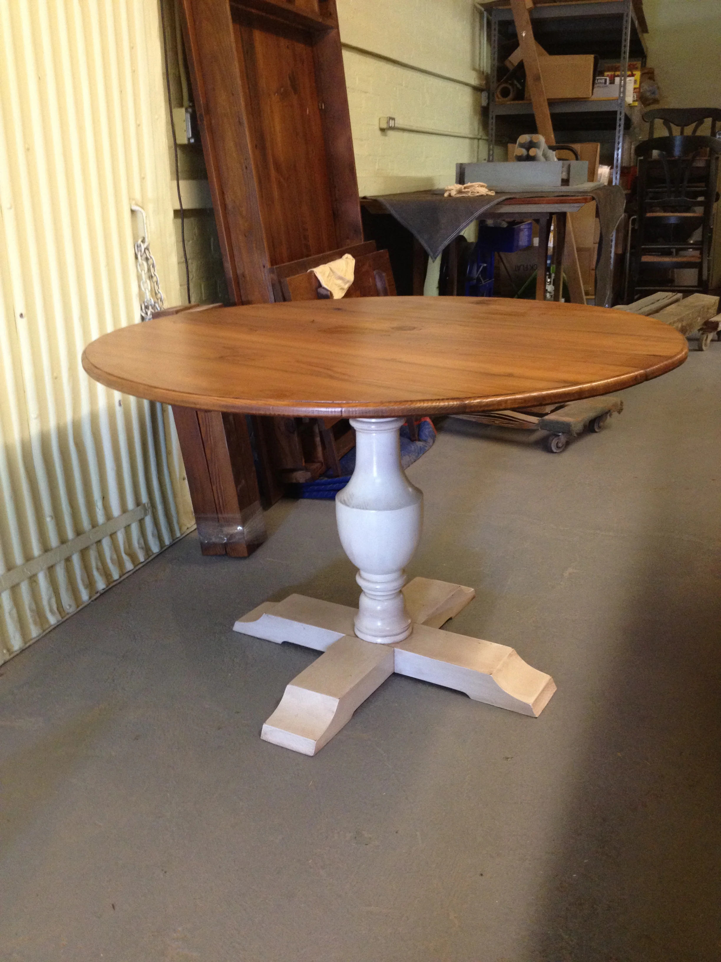 48"round thin top table with Urn pedestal finished in Golden Brown with a glazed Snow White base