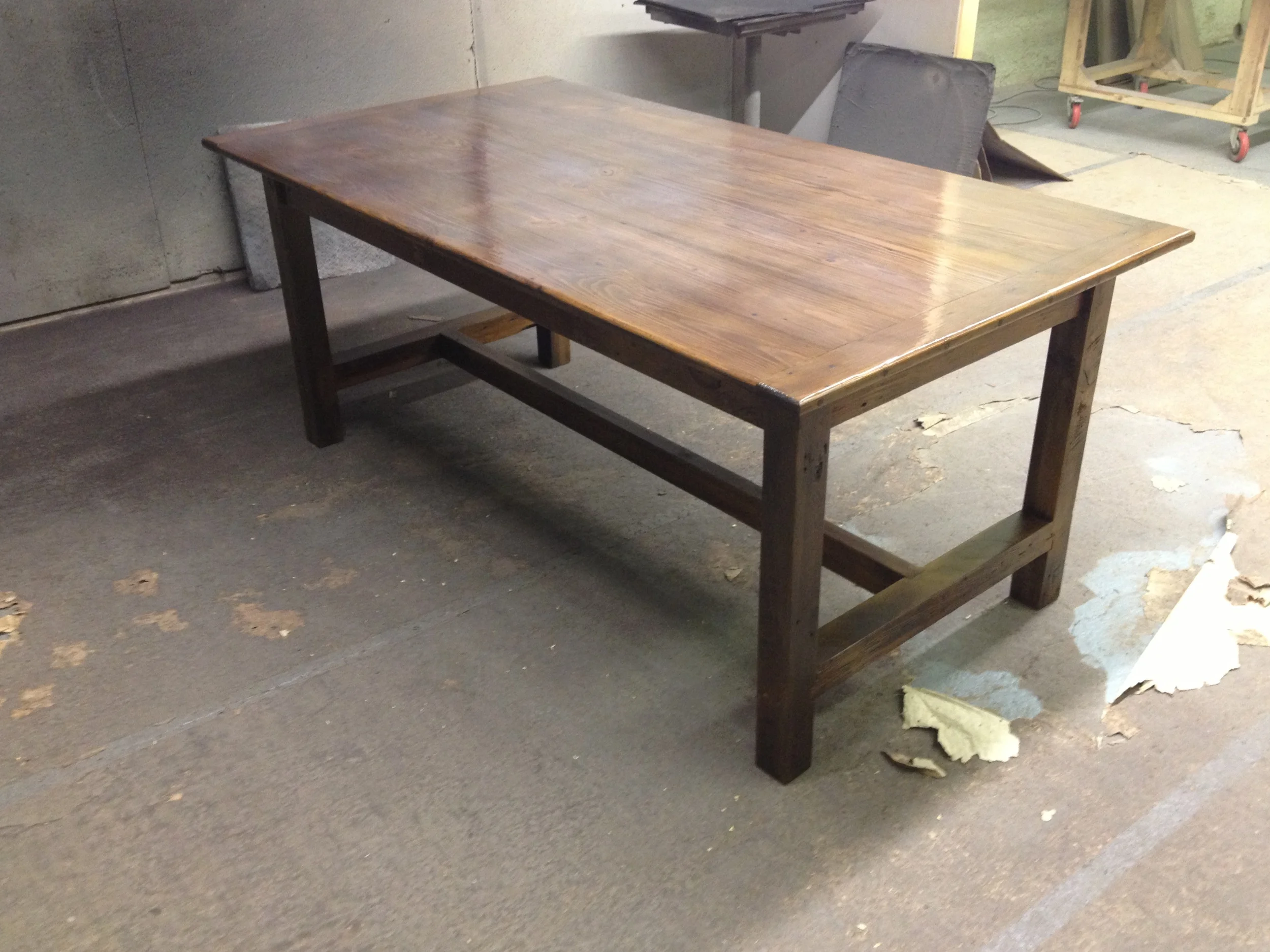 7' thin top straight legged refectory table finished in Hazelnut