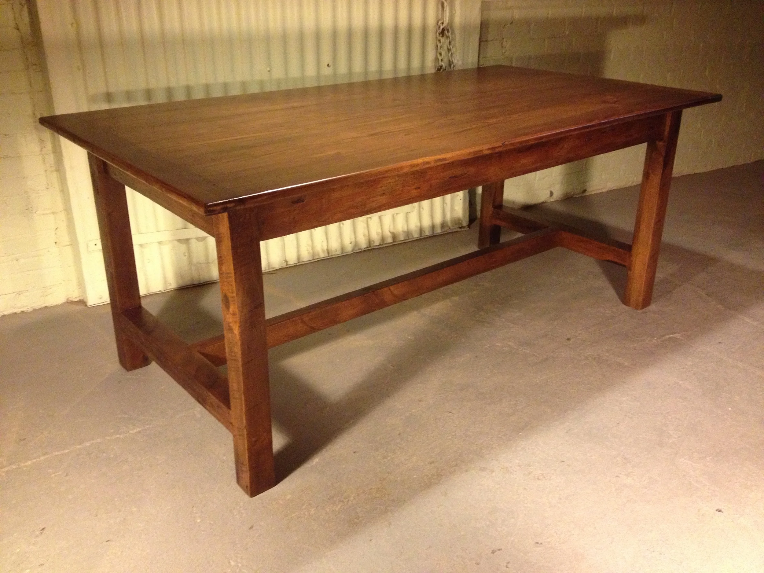 7' thin top straight legged refectory table finished in Hazelnut