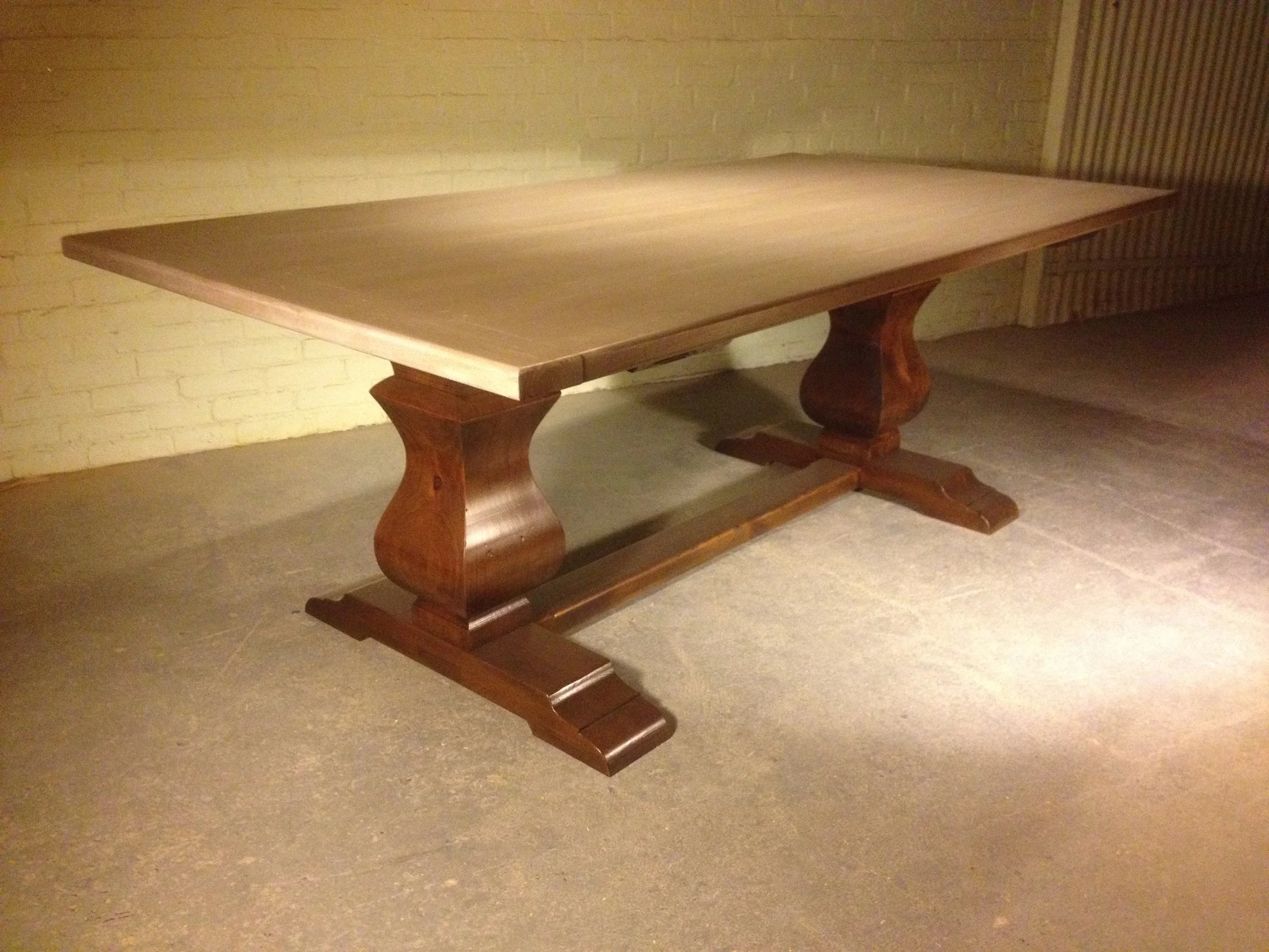 96"x38" thick top barnwood table with 4" breadboard ends and a double Davis pedestal finished in Walnut with a Driftwood top