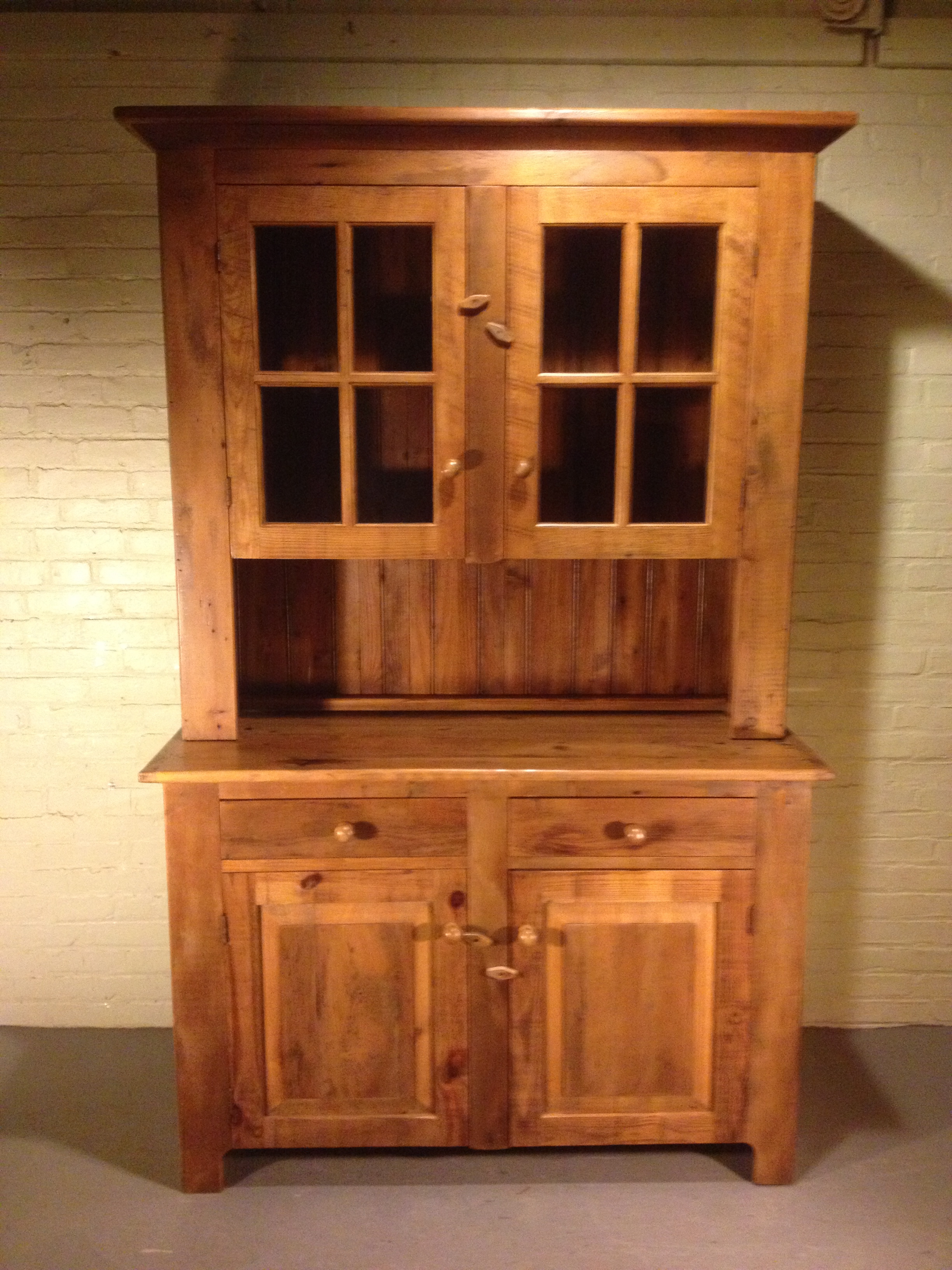 42"x18"x76"h glass door hutch finished in Golden Brown