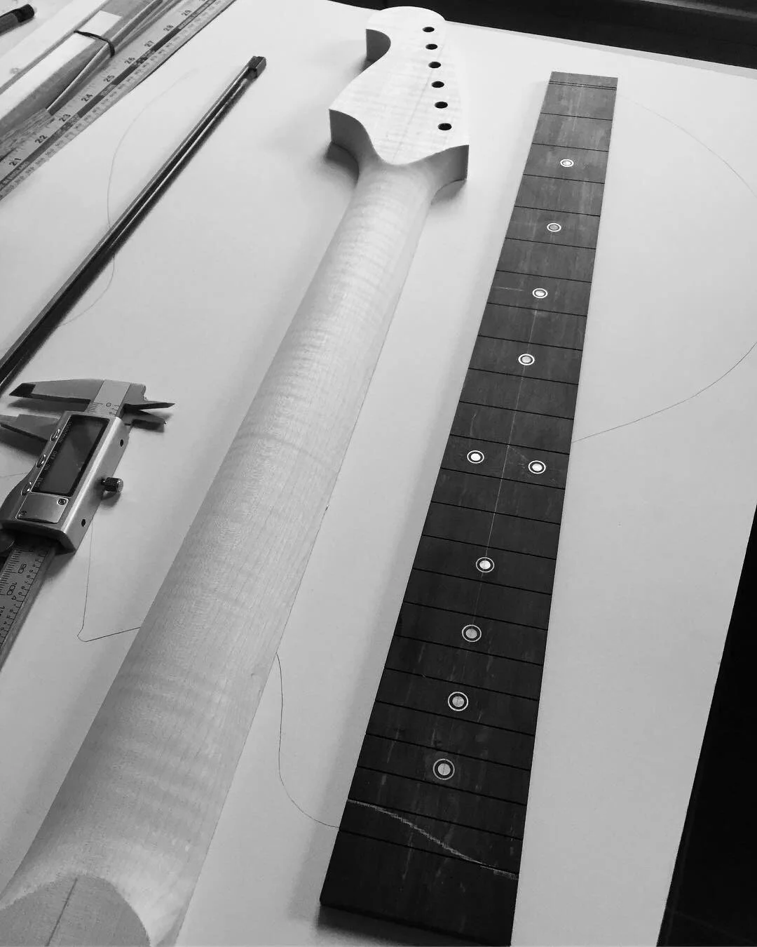 Pearl dot and silver ring inlays. Ebony fingerboard