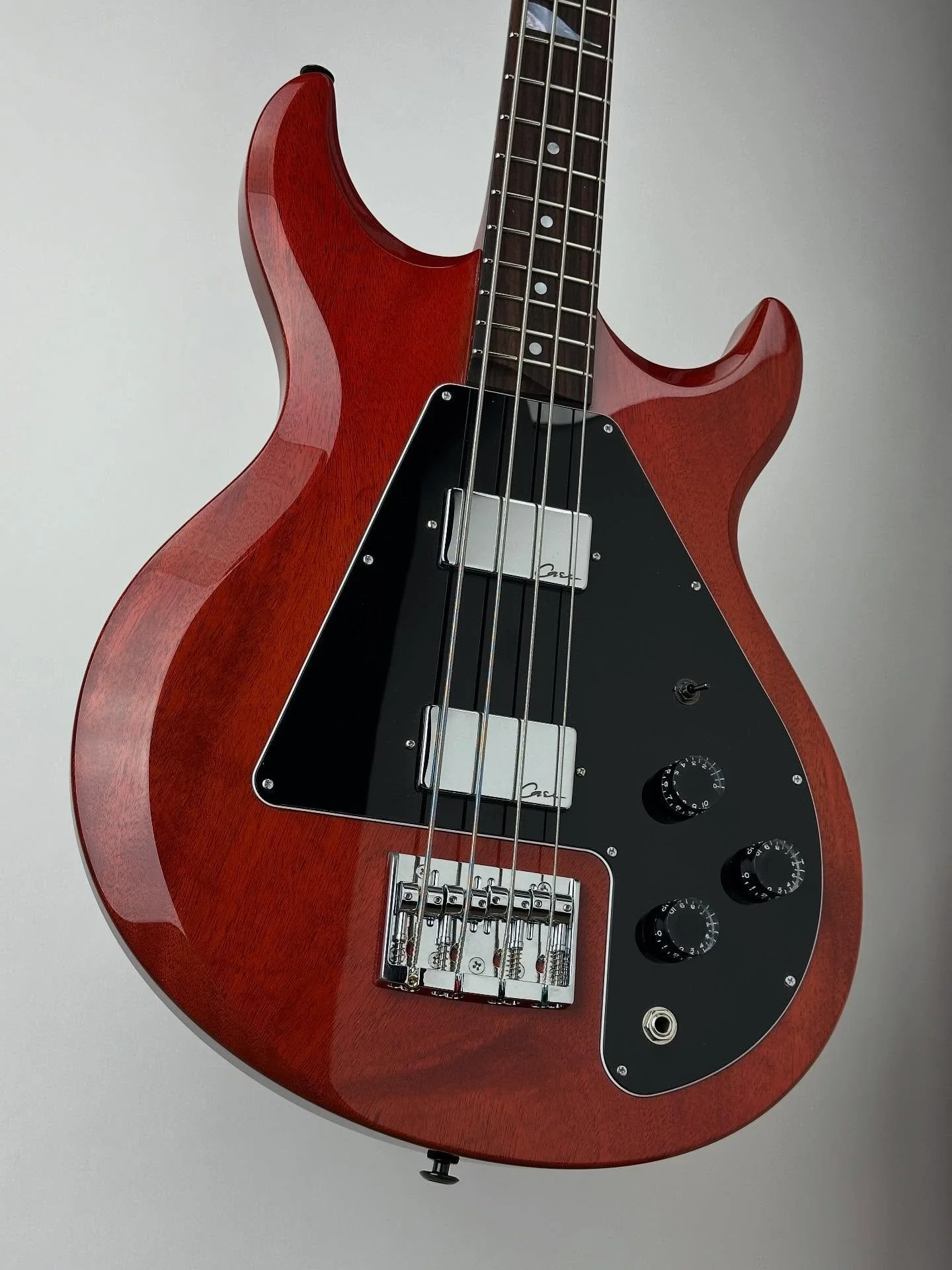 All mahogany Rippa bass in a beautiful cherry red nitro cellulose finish. Hand wound Armstrong pickups featuring ceramic horseshoe magnet for a warm punchy tone. #handmadebass #custombass #gibsonbass #cherryred