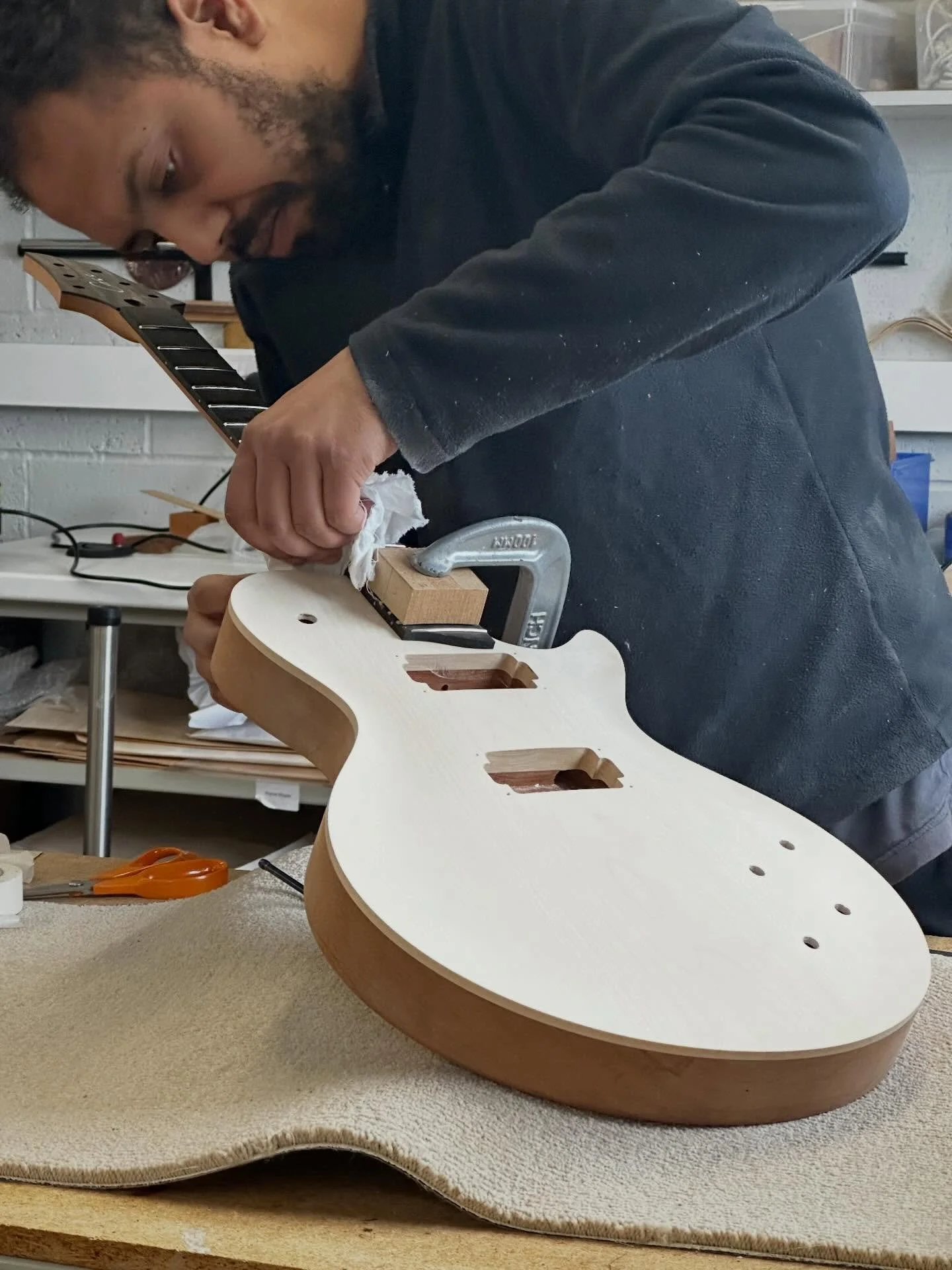 Our J1 neck joint is designed for maximum comfort and reach. Angled on two axis giving access to the highest of frets like no other, especially when combined with a hand sculpted comfort carve option.  #caseguitars #luthier #guitarbuild