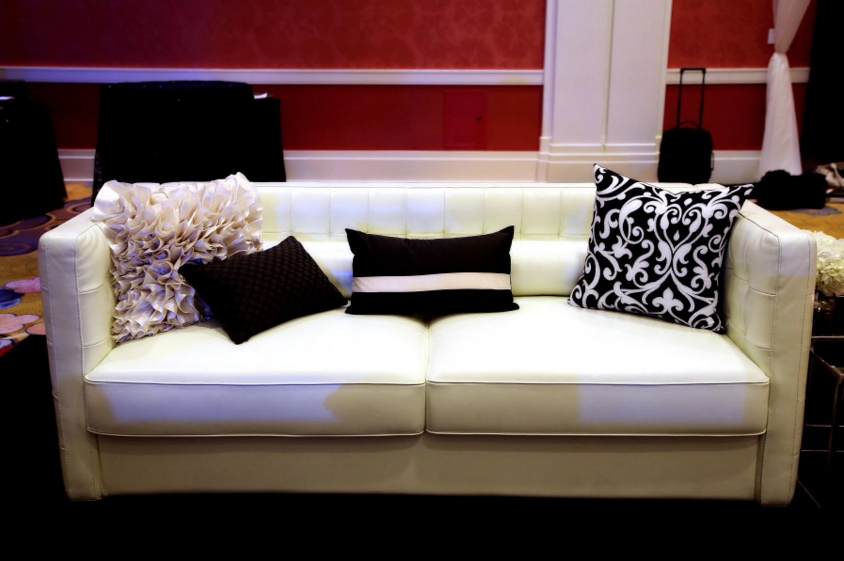 modern white couch in hotel wedding
