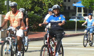 Former Mayor Kip Holden riding as part of the Annual Mayor's Family Bike Day. Photo: Parks & Recreation Magazine.