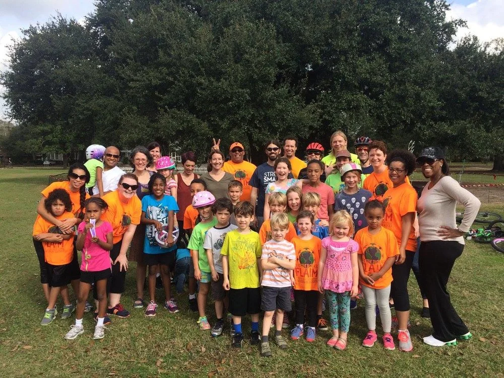 Bike Baton Rouge volunteers, parents, and children participating in a bike safety class at the Baton Rouge FLAIM School 2016.
